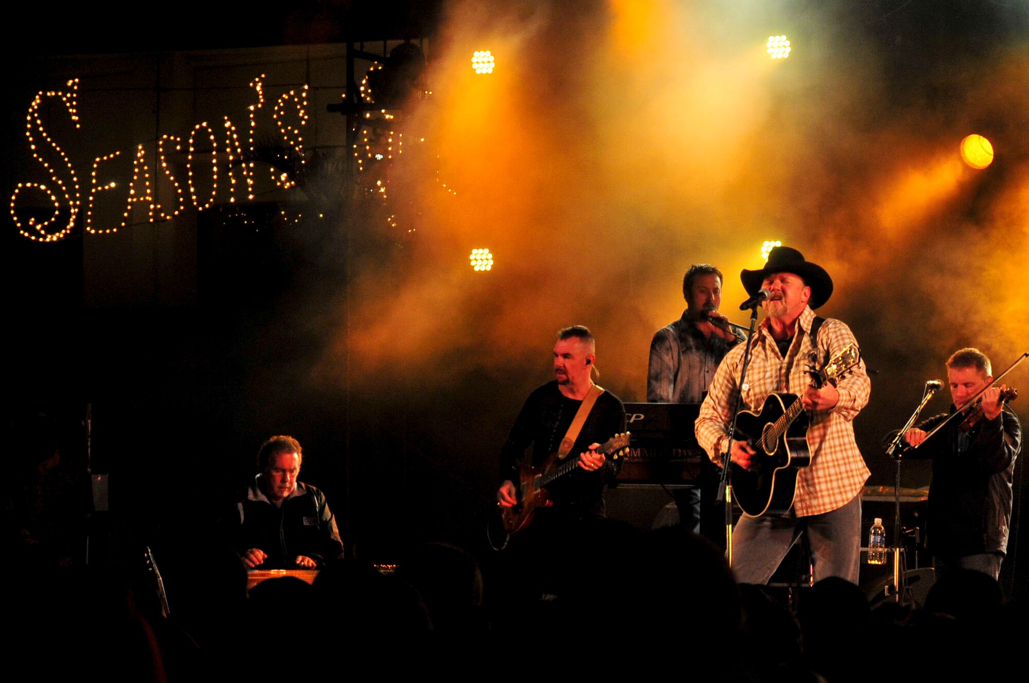 Country music artist, Trace Adkins performs for service members and their families at an 18th Force Support Squadron and USO-hosted concert in the Schilling community center parking lot on Kadena Air Base, Japan Dec. 1, 2012. The country music star performed a variety of songs and thanked the crowd for their service. (U.S. Air Force photo/Staff Sgt. Darnell T. Cannady)  