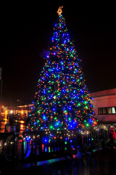 Kadena's Christmas tree stands fully lit during the tree lighting event during the Tinsel Town event on Kadena Air Base, Japan, Dec. 1, 2012. As part of the last event of the annual Tinsel Town event the base's tree was turned on by Brig. Gen. Matt Molloy, 18th Wing commander, Santa, Mrs. Clause and children of deployed service members. U.S. Air Force photo/Staff Sgt. Darnell T. Cannady)  