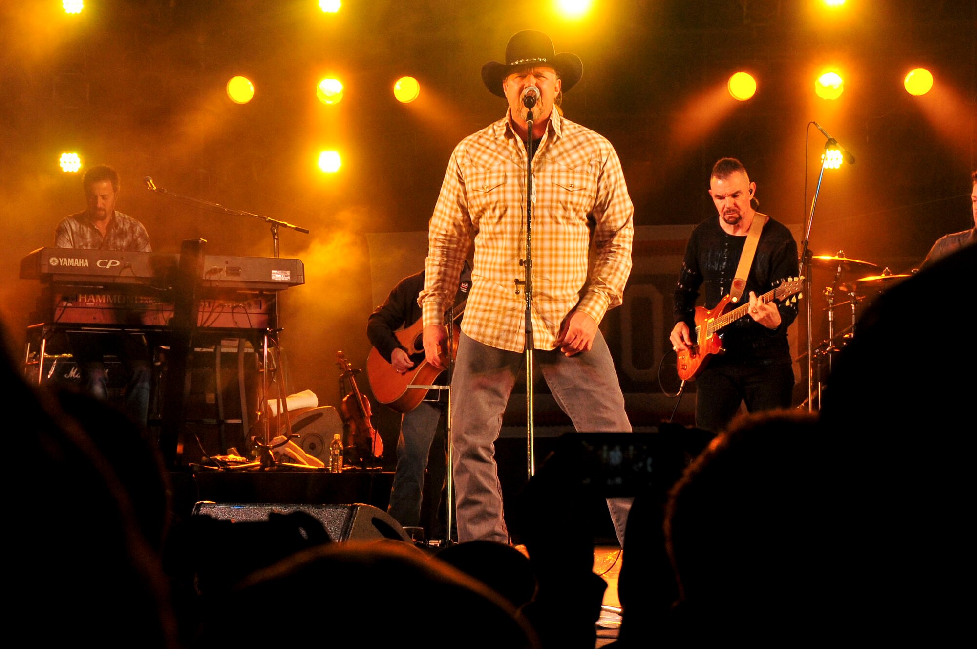 Country music artist, Trace Adkins performs for service members and their families at an 18th Force Support Squadron and USO-hosted concert in the Schilling community center parking lot on Kadena Air Base, Japan Dec. 1, 2012. The country music star performed a variety of songs and thanked the crowd for their service. (U.S. Air Force photo/Staff Sgt. Darnell T. Cannady)  