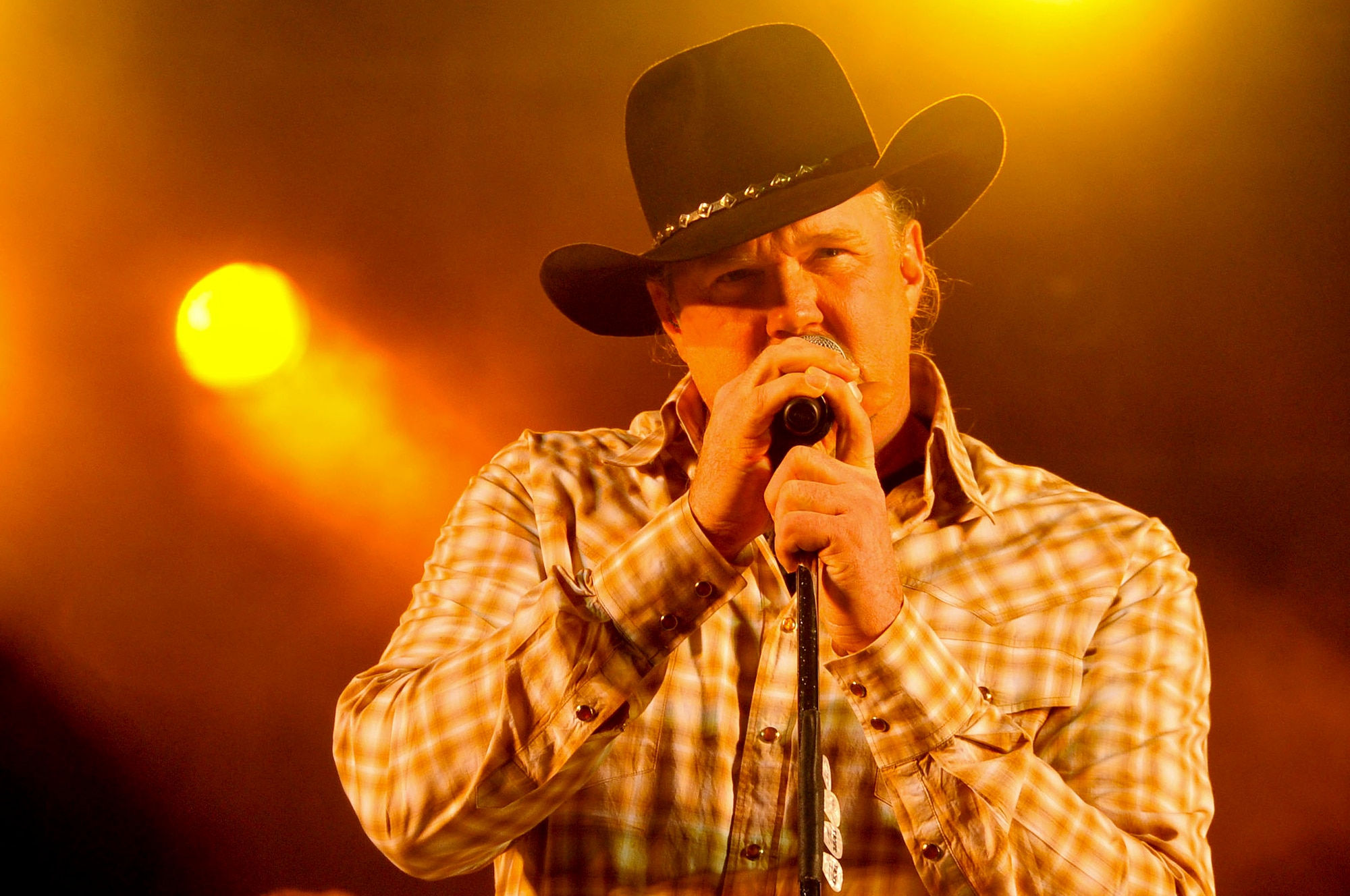 Country music artist, Trace Adkins performs for service members and their families at an 18th Force Support Squadron and USO-hosted concert in the Schilling community center parking lot on Kadena Air Base, Japan Dec. 1, 2012. The country music star performed a variety of songs and thanked the crowd for their service. (U.S. Air Force photo/Staff Sgt. Darnell T. Cannady)  
