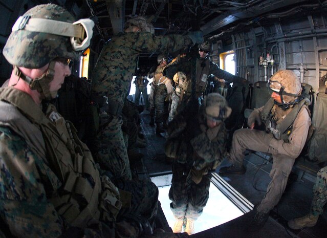 Marines with Alpha Company, Battalion Landing Team 1st Battalion, 2nd Marine Regiment, 24th Marine Expeditionary Unit, conduct fast-rope training from a CH-53E Super Stallion onto the flight deck of the USS New York, Nov. 30, 2012. The 24th Marine Expeditionary Unit is deployed with the Iwo Jima Amphibious Ready Group in the 6th Fleet area of responsibility serving as an expeditionary crisis response force capable of a variety of missions from full-scale combat to evacuations and humanitarian assistance.