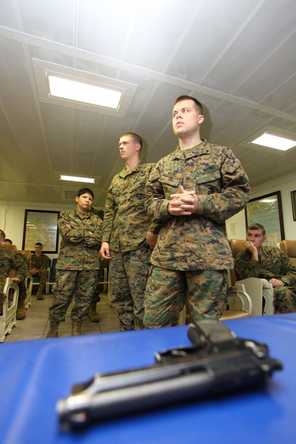 USS IWO JIMA, Mediterranean Sea (Nov. 30, 2012) - Marines with the Command Element, 24th Marine Expeditionary Unit, line up to practice M9 pistol techniques during a combat marksmanship class aboard USS Iwo Jima, Nov. 30, 2012. Combat marksmanship training is a continuous part of life for Marines, no matter what their military occupational specialty is, and regardless of whether they're stateside or deployed on a ship. The 24th Marine Expeditionary Unit is deployed with the Iwo Jima Amphibious Ready Group in the 6th Fleet area of responsibility serving as an expeditionary crisis response force capable of a variety of missions, from full-scale combat to evacuations and humanitarian assistance. Since deploying in March, they have supported a variety of missions in the U.S. Central, Africa and European Commands, assisted the Navy in safeguarding sea lanes, and conducted various bilateral and unilateral training events in several countries in the Middle East and Africa. (U.S. Marine Corps photo by Lance Cpl. Tucker S. Wolf/Released)
