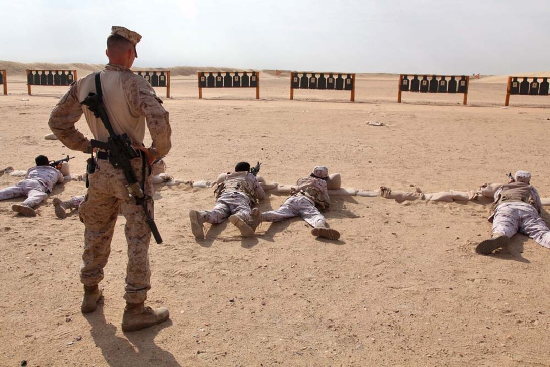 Staff Sgt. Nathan C. Stocking, platoon sergeant, Scout Sniper Platoon, Weapons Company, Battalion Landing Team 3/5, 15th Marine Expeditionary Unit, instructs members of the Kuwait Armed Forces in basic marksmanship techniques at a firing range near Camp Buehring during Exercise Eager Mace 13, Nov. 12. The U.S. Navy and Marine Corps participated in the bilateral training exercise with the Kuwait Armed Forces Nov. 11-21. The purpose of the exercise was to expand levels of cooperation, enhance mutual maritime capabilities, as well as promote long-term regional stability and interoperability between U.S. forces and regional partners. The 15th MEU is deployed as part of the Peleliu Amphibious Ready Group as a theater reserve and crisis response force throughout U.S. Central Command and the U.S. 5th Fleet area of responsibility. Stocking, 29, is from Phoenix, Ariz.  (U.S. Marine Corps photo by Cpl. Timothy Childers/Released)