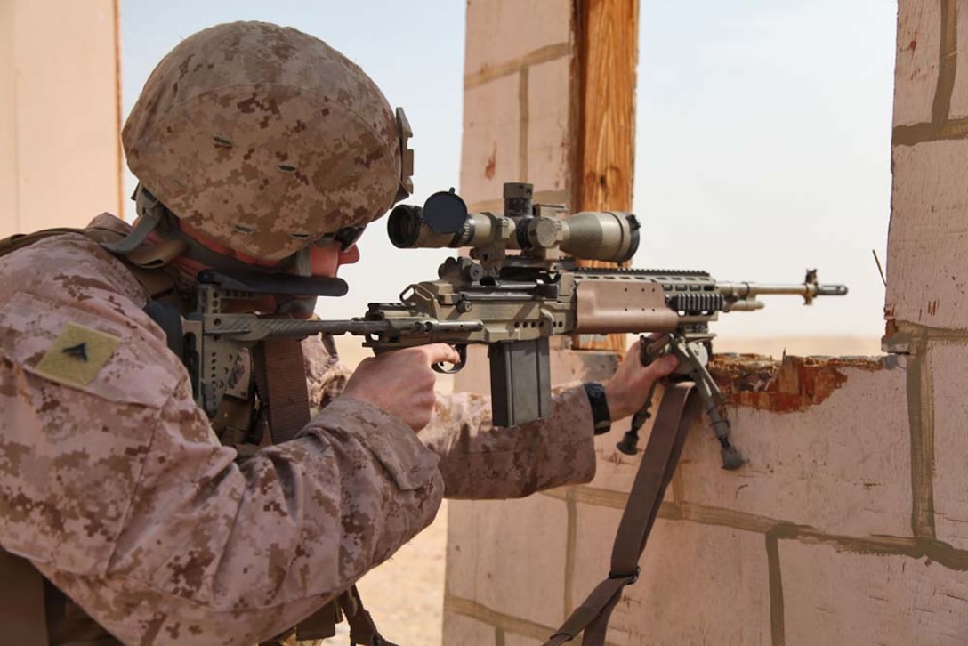 Lance Cpl. Matthew Long, scout sniper, Scout Sniper Platoon, Weapons Company, Battalion Landing Team 3/5, 15th Marine Expeditionary Unit, fires a M39 enhanced marksmanship rifle at a marksmanship training event near Camp Buehring during Exercise Eager Mace 13, Nov. 12. The U.S. Navy and Marine Corps participated in the bilateral training exercise with the Kuwait Armed Forces Nov. 11-21. The purpose of the exercise was to expand levels of cooperation, enhance mutual maritime capabilities, as well as promote long-term regional stability and interoperability between U.S. forces and regional partners. The 15th MEU is deployed as part of the Peleliu Amphibious Ready Group as a theater reserve and crisis response force throughout U.S. Central Command and the U.S. 5th Fleet area of responsibility. Long, 27, is from Kilgore, Texas. (U.S. Marine Corps photo by Cpl. Timothy Childers/Released)