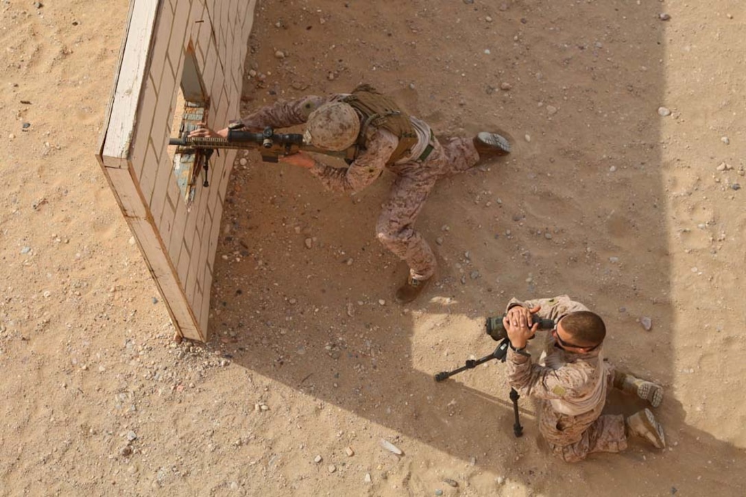 A U.S. Marine from Scout Sniper Platoon, Weapons Company, Battalion Landing Team 3/5, 15th Marine Expeditionary Unit, fires a semi-automatic sniper system at a marksmanship training event near Camp Buehring during Exercise Eager Mace 13, Nov. 12. The U.S. Navy and Marine Corps participated in the bilateral training exercise with the Kuwait Armed Forces Nov. 11-21. The purpose of the exercise was to expand levels of cooperation, enhance mutual maritime capabilities, as well as promote long-term regional stability and interoperability between U.S. forces and regional partners. The 15th MEU is deployed as part of the Peleliu Amphibious Ready Group as a theater reserve and crisis response force throughout U.S. Central Command and the U.S. 5th Fleet area of responsibility. (U.S. Marine Corps photo by Cpl. Timothy Childers/Released)