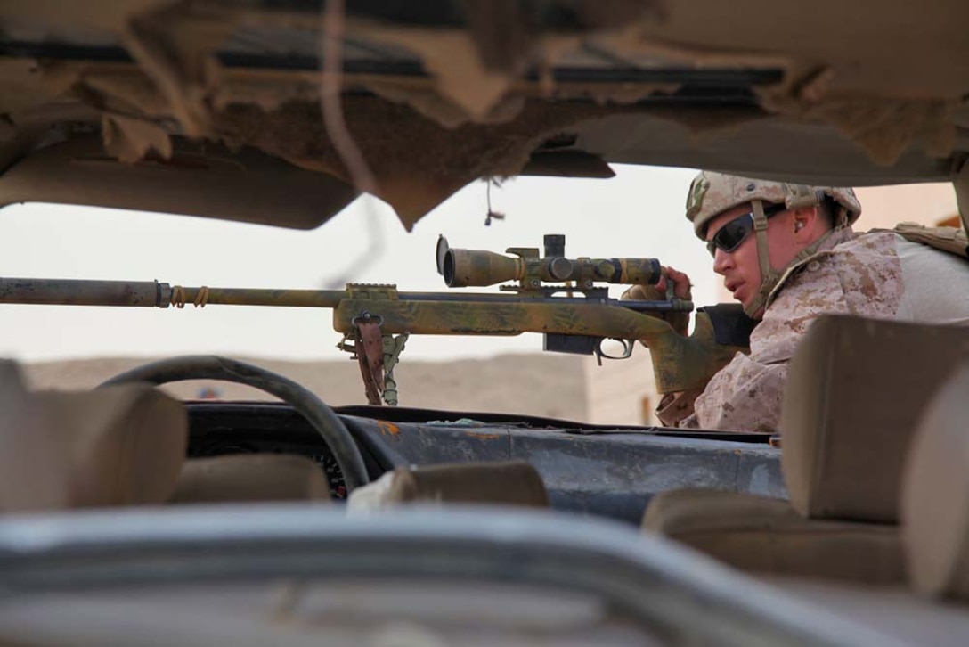 Cpl. Dakota Mortensen, scout sniper, Scout Sniper Platoon, Weapons Company, Battalion Landing Team 3/5, 15th Marine Expeditionary Unit, fires a M40A5 rifle at a marksmanship training event near Camp Buehring during Exercise Eager Mace 13, Nov. 12. The U.S. Navy and Marine Corps participated in the bilateral training exercise with the Kuwait Armed Forces Nov. 11-21. The purpose of the exercise was to expand levels of cooperation, enhance mutual maritime capabilities, as well as promote long-term regional stability and interoperability between U.S. forces and regional partners. The 15th MEU is deployed as part of the Peleliu Amphibious Ready Group as a theater reserve and crisis response force throughout U.S. Central Command and the U.S. 5th Fleet area of responsibility. Mortensen, 25, is from Ephraim, Utah.  (U.S. Marine Corps photo by Cpl. Timothy Childers/Released)