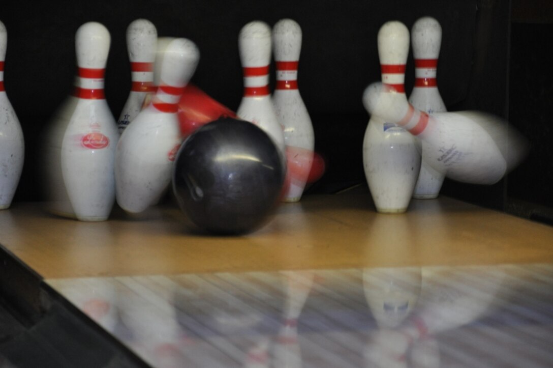 Bowling pins dropping at the hands of Marines aboard Marine Corps Logistics base Barstow, Nov. 30. Marines paid $10 to participate in a bowling tournament aboard the base; all proceeds went to the Combined Federal Campaign. 