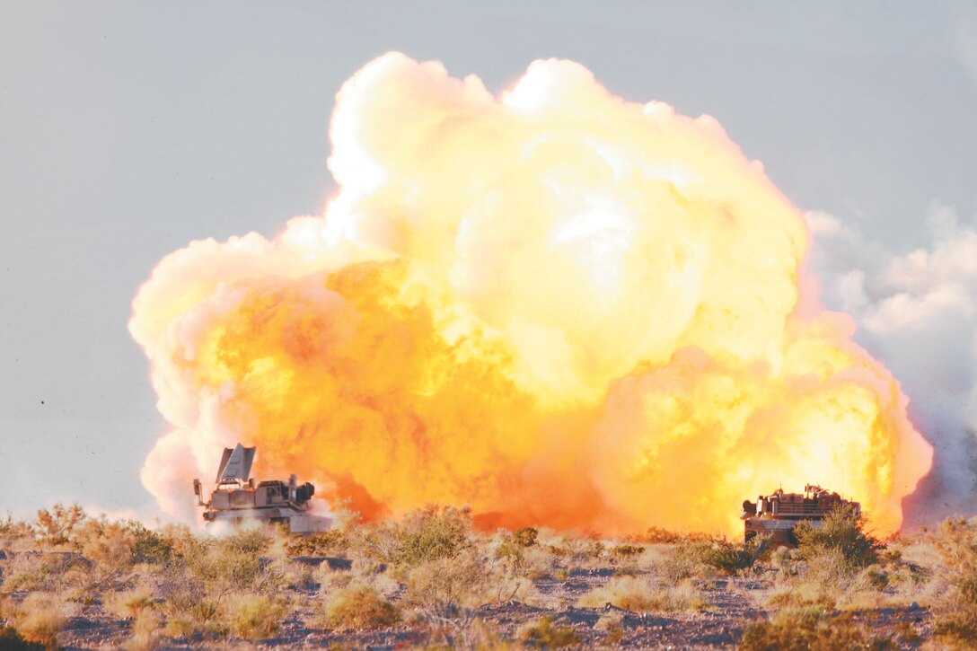 A Mine Clearing Line Charge explodes as 1st Tank Battalion tanks prepare to assault through their objective during a portion of the combined arms exercise known as Steel Knight Dec. 12, 2008.