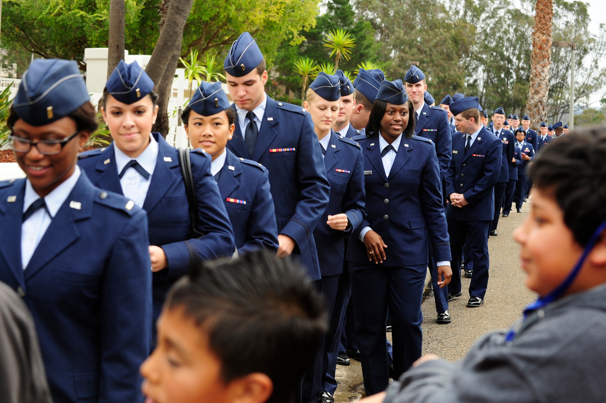 VANDENBERG AIR FORCE BASE, Calif. – Nearly 200 Airmen wait to escort children into the Pacific Coast Club for the 53rd annual Operation Kids Christmas here Saturday, Dec. 1, 2012. OKC is an annual event, organized and run by a private organization, in which about 200 local children are brought on base and given the opportunity to play games, meet Santa and enjoy the companionship of volunteer military members. (U.S. Air Force photo/Senior Airman Lael Huss)