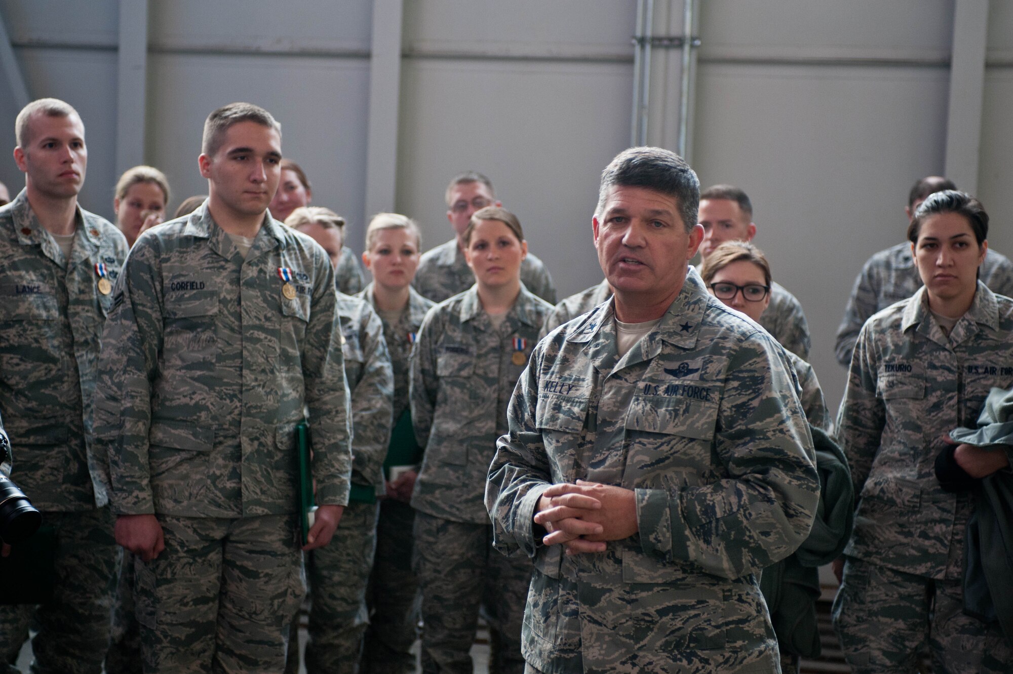 Brig. Gen. Todd Kelly, North Carolina National Guard assistant adjutant general-air, congratulates Airmen at Ellsworth Air Force Base, S.D., Nov. 28, 2012 for their excellence and professionalism during the C-130 crash response that occurred in southwestern South Dakota during  July 2012. Ellsworth Airmen secured the site, aided in the investigation, and preserved the wreckage. (U.S. Air Force photo by Airman 1st Class Zachary Hada/Released)