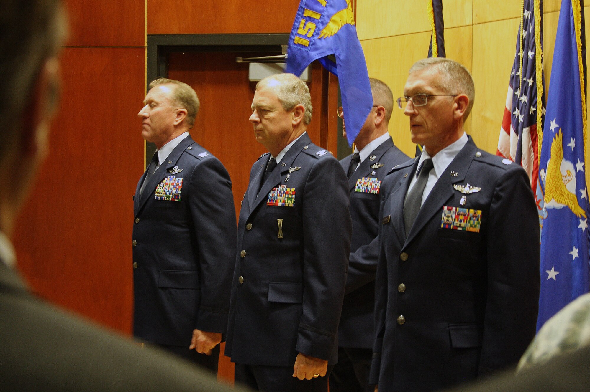 Col. Samuel Ramsay, Col. Paul Byrd and Lt. Col. Kevin Windsor stand at attention during a change-of-command ceremony at the Utah Air National Guard base Dec. 2. During the ceremony officiated by Ramsay, the wing commander, Byrd relinquished command of the 151st Medical Group and Windsor assumed command. (U.S. Air Force photo courtesy of Dee Brady)(RELEASED)
