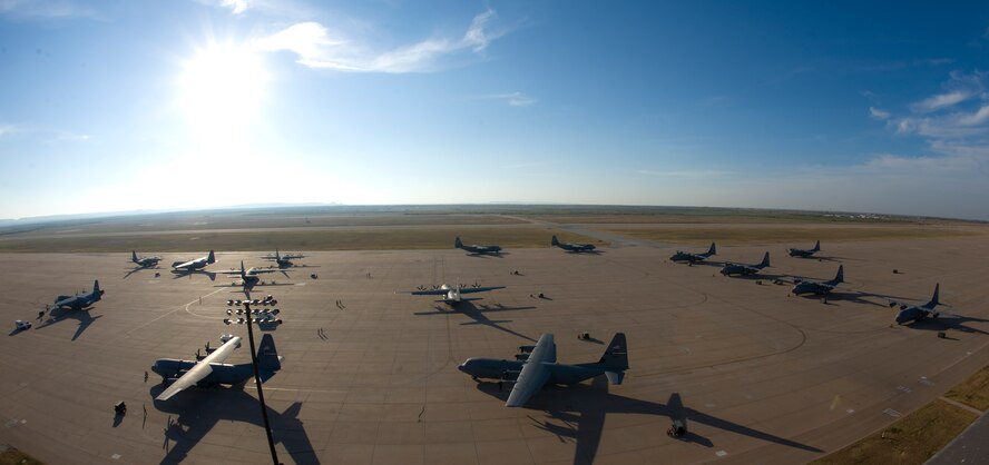 C-130Js taxi toward the runway during a training exercise Nov. 30, 2012, at Dyess Air Force Base, Texas. The C-130J incorporates state-of-the-art technology to reduce manpower requirements, lower operating and support costs, and provides life-cycle cost savings over earlier C-130 models. Compared to older C-130s, the J model climbs faster and higher, flies farther at a higher cruise speed, and takes off and lands in a shorter distance. Dyess has received 23 J models and is scheduled to get a total of 28, making it the largest C-130J unit in the world. (U.S. Air Force photo by Staff Sgt. Richard P. Ebensberger/ Released)
