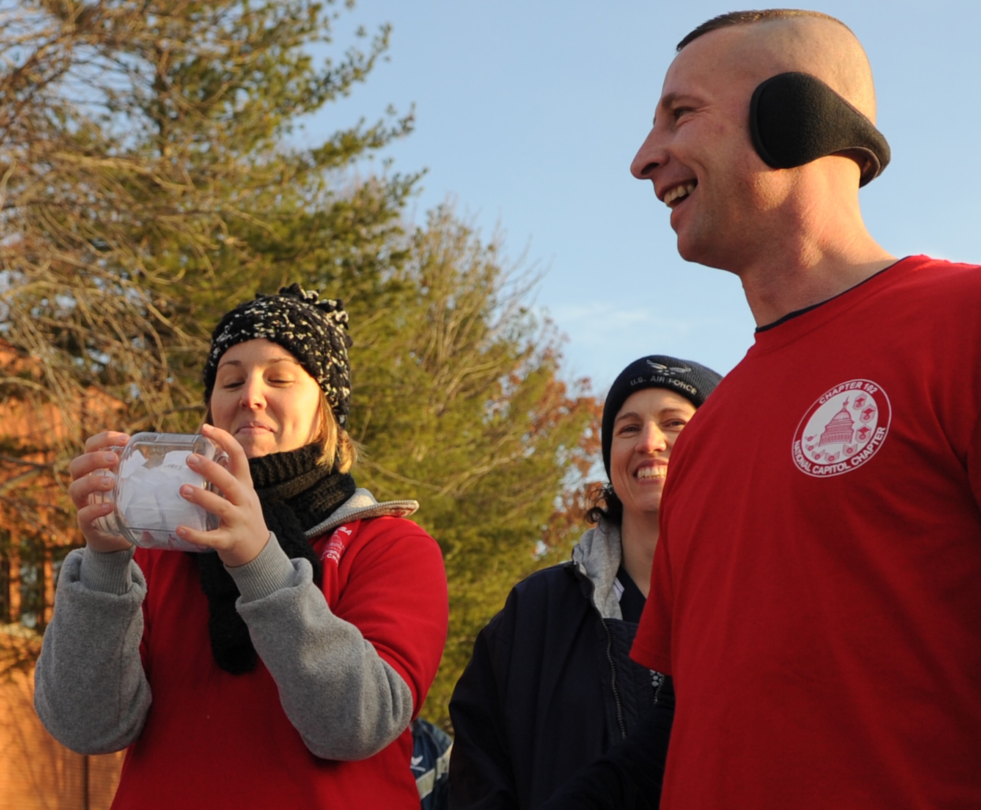 Tech. Sgt. Amanda Mocanu, Air Force Sergeants Association  Chapter 102 Vice President, Tech. Sgt. Katherine Edgar, AFSA member and Senior Master Sgt. Johnny Hamm, AFSA Chapter 102 president draw names at the West Fitness Center, Nov. 30, 2012. AFSA hosted the Jingle Bell Jaunt 5k where they held prize drawings and gave away gifts. (U.S. Air Force photo/Airman 1st Class Nesha Humes)(Released)