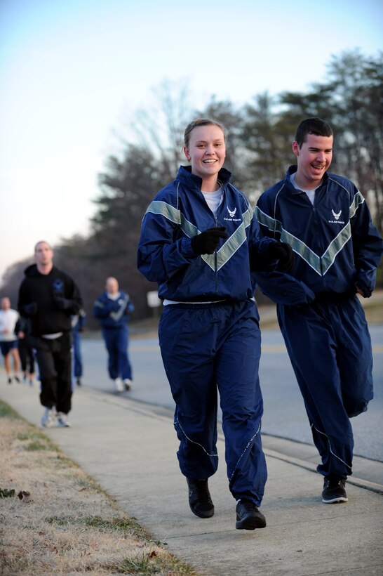 Airmen run through housing, Nov. 30, 2012 During the Jingle Bell Jaunt 5k. The event was held by the federally chartered non-profit organization Air Force Sergeants Association Chapter 102. AFSA represents the professional and personal interests of active duty, guard, reserve, retired and veteran Airmen and their families. (U.S. Air Force photo/Airman 1st Class Nesha Humes)(Released)