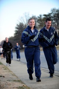 Airmen run through housing, Nov. 30, 2012 During the Jingle Bell Jaunt 5k. The event was held by the federally chartered non-profit organization Air Force Sergeants Association Chapter 102. AFSA represents the professional and personal interests of active duty, guard, reserve, retired and veteran Airmen and their families. (U.S. Air Force photo/Airman 1st Class Nesha Humes)(Released)