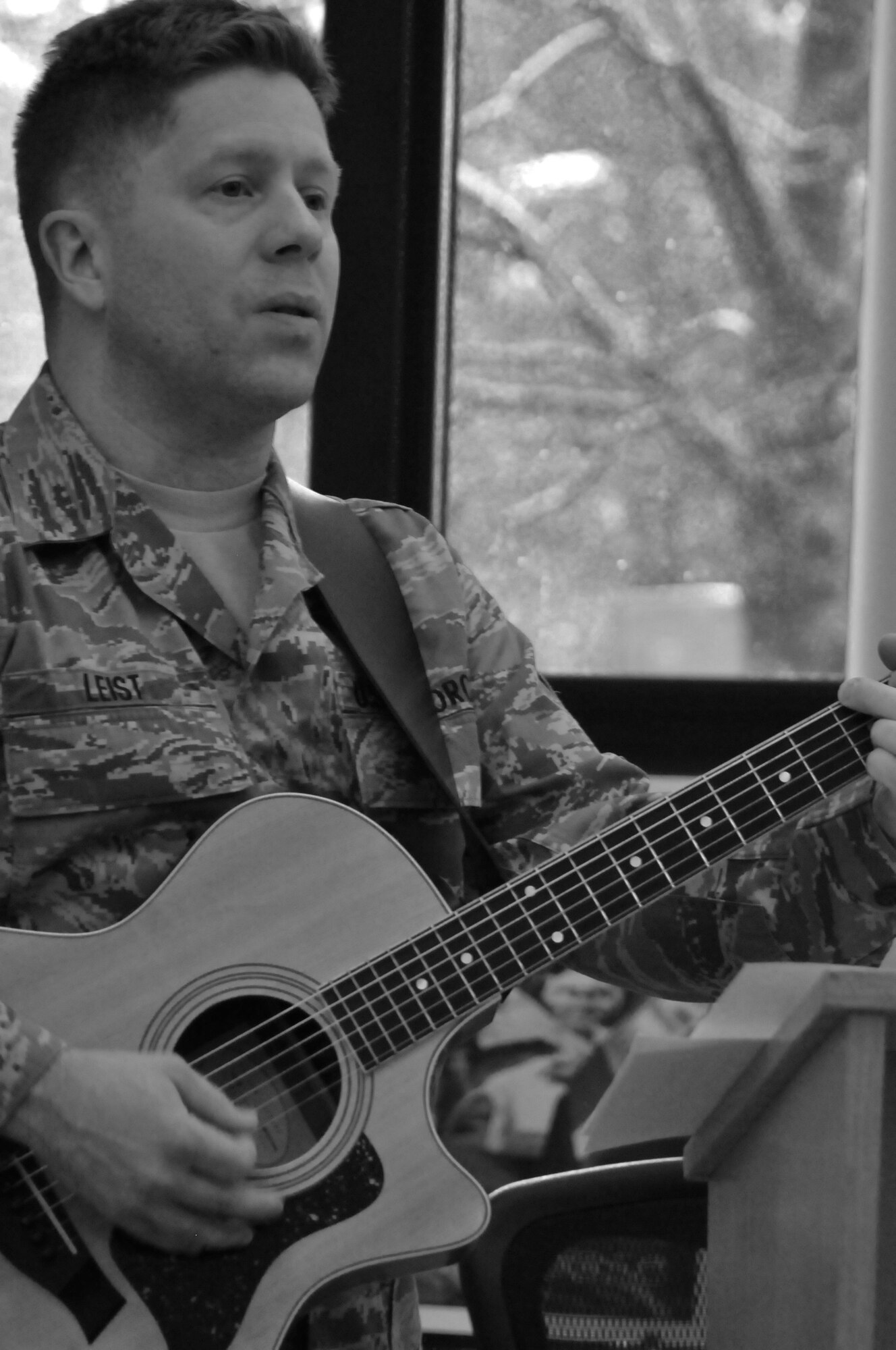 YOUNGSTOWN AIR RESERVE STATION, Ohio -- U.S. Air Force Reserve Staff Sgt. Mark Leist, chaplain assistant, 910th Airlift Wing here, leads the singing of a Christmas hymn Dec. 2, 2012 here. Leist directs the worship music for Protestant service during each Unit Training Assembly. (U.S. Air Force photo by Senior Airman Ron Dombkowski)