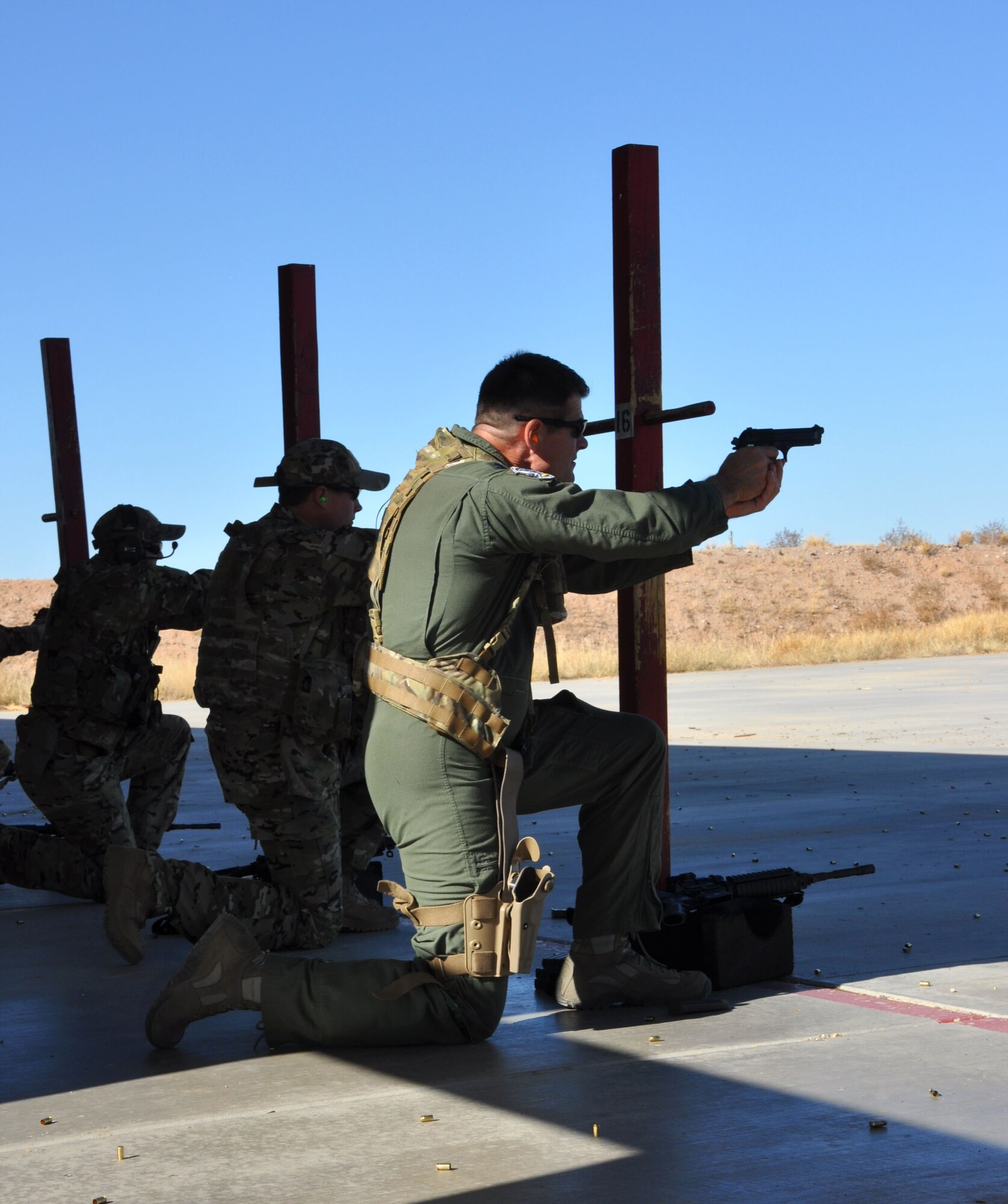Col. Harold Maxwell, 943rd Rescue Group commanders, takes aim with the 9MM pistol during a weapons qualification shoot during the December Unit Training Assembly weekend. Colonel Maxwell participated in the shoot along with aircrew from the 305th Rescue Squadron. (U.S. Air Force Photo/ Staff Sgt. Sarah Pullen)