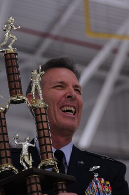 YOUNGSTOWN AIR RESERVE STATION, Ohio – U.S. Air Force Reserve Brig. Gen. Brian Dominguez, interim wing commander, 910th Airlift Wing here, hoists the station’s Intramural Championship trophy Dec. 1, 2012 here. The award was presented during the annual holiday Commander’s Call. (U.S. Air Force photo by Senior Airman Ron Dombkowski) 