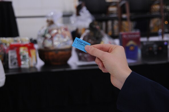 YOUNGSTOWN AIR RESERVE STATION, Ohio -- A U.S. Air Force Reserve Airman checks her ticket for the winning number Dec. 2, 2012 during the December Unit Training Assembly here. The 910th Airlift Wing Chief's Group hosted a holiday party at the conclusion of commander's call and they awarded Airmen gift baskets and prizes. (U.S. Air Force photo by Senior Airman Ron Dombkowski) 