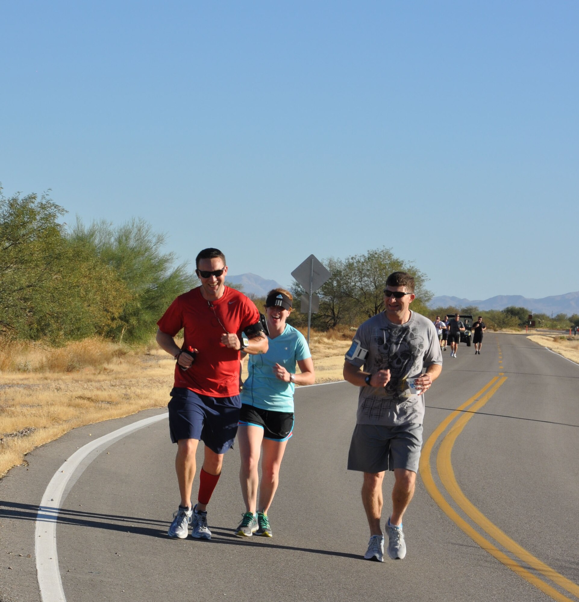 943rd Rescue Group Airmen share a laugh during the first ever 943rd RQG Holiday Fun Run. The 943rd Top Three sponsored the fun run and awarded t-shirts to the top finishers. (U.S. Air Force Photo/ Staff Sgt. Sarah Pullen)