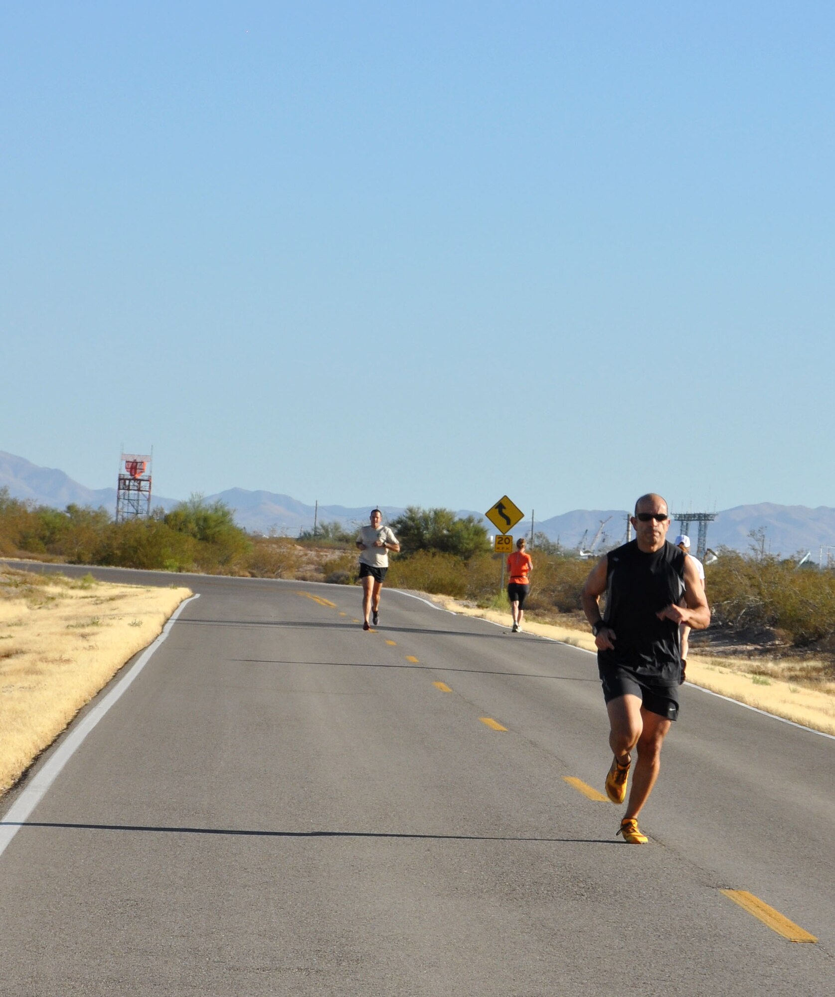 Capt. Ricardo Montana, 306th Rescue Squadron combat rescue officer, runs the final stretch of the 10 kilometer fun run during the 943rd Rescue Groups first ever Holiday Fun Run, December 2. The 943rd RQG Top Three sponsored the run that consisted of a five and 10 kilometer race. (U.S. Air Force Photo/ Staff Sgt. Sarah Pullen) 