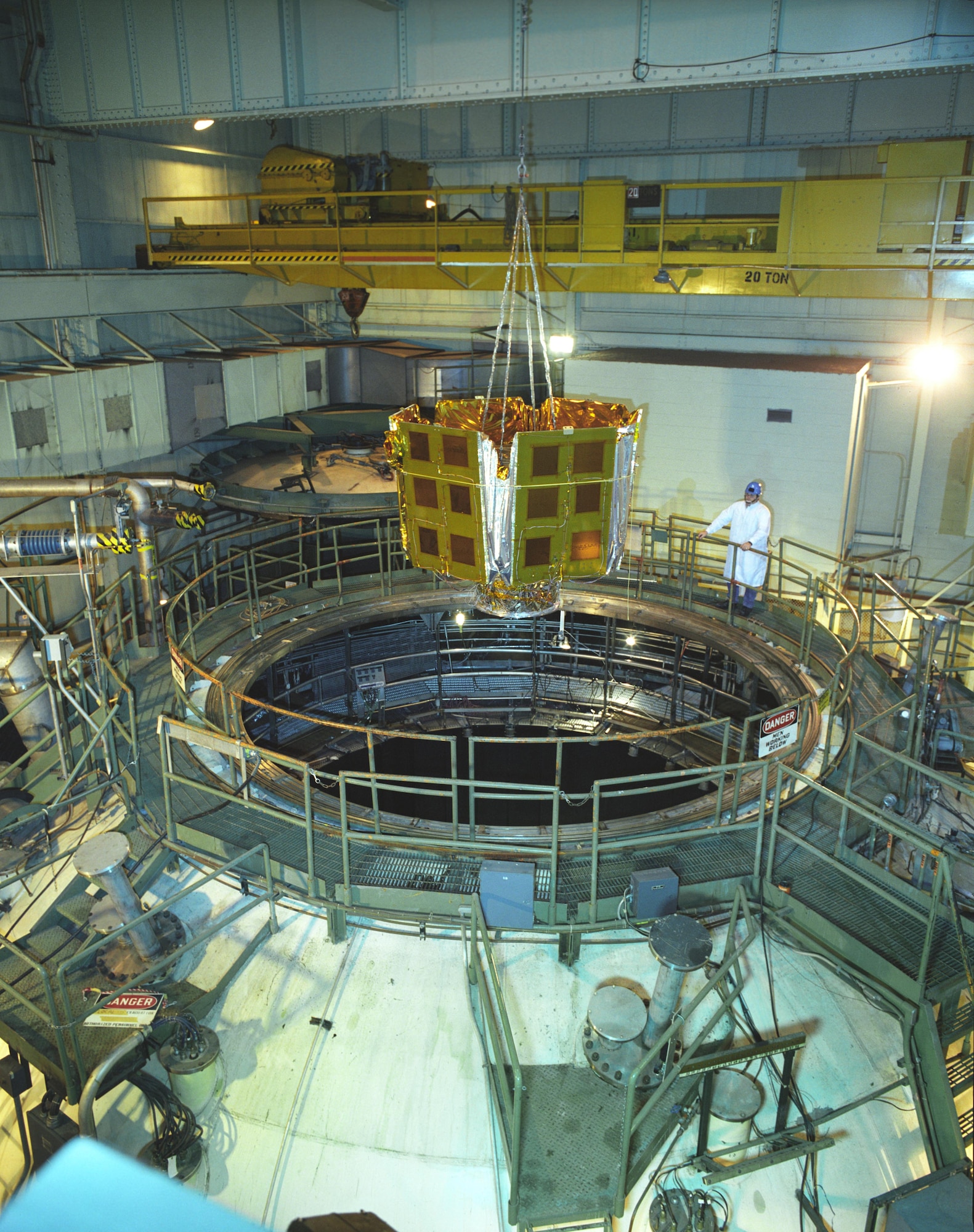 Ricky Bush, an ATA lead machinist for Arnold’s space chambers test cells, watches the removal of the NASA/Goddard Space Flight Center’s Microwave Anisotropy Probe from AEDC’s Mark I Space Environmental Chamber following a successful solar panel deployment test.