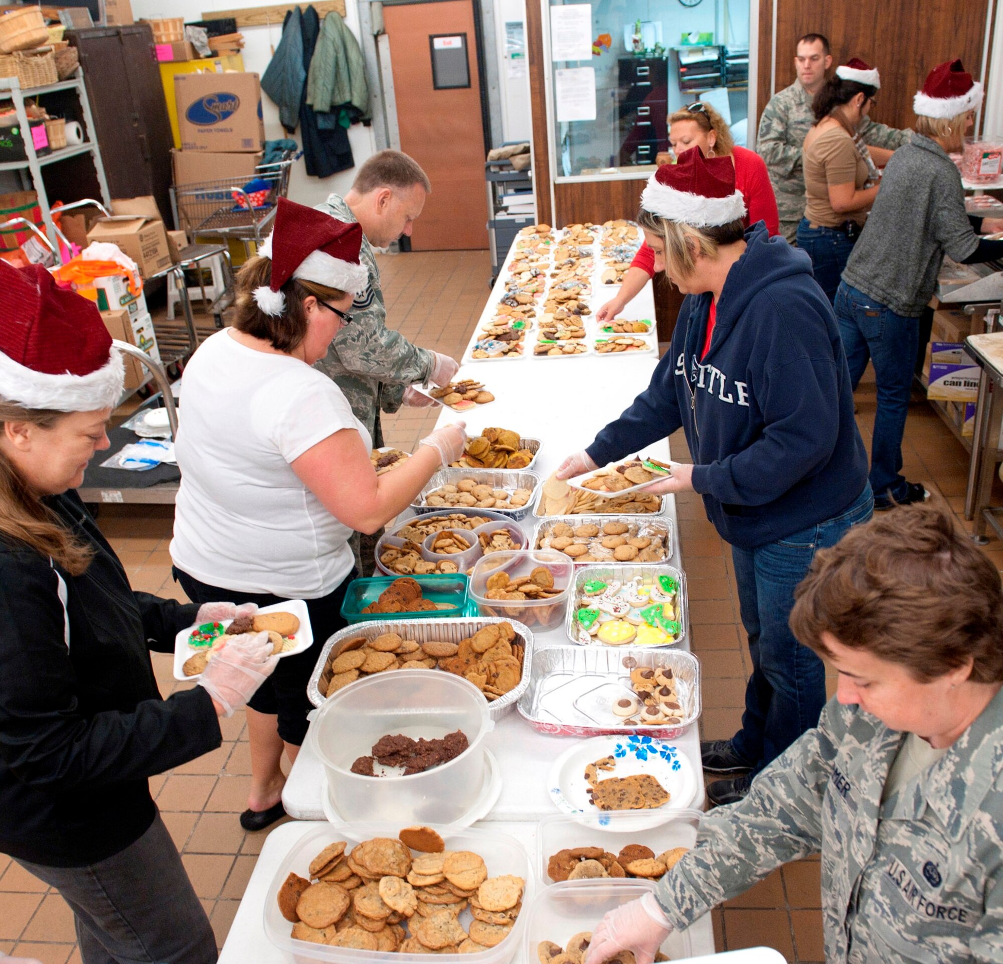 Team Tyndall members packaged donated cookies at the base commissary for the 2012 Cookie Caper Dec. 3. The Cookie Caper is an annual program designed to deliver cookies to Airmen living in the dormitories. (U.S. Air Force photo by Christopher Cokeing) 