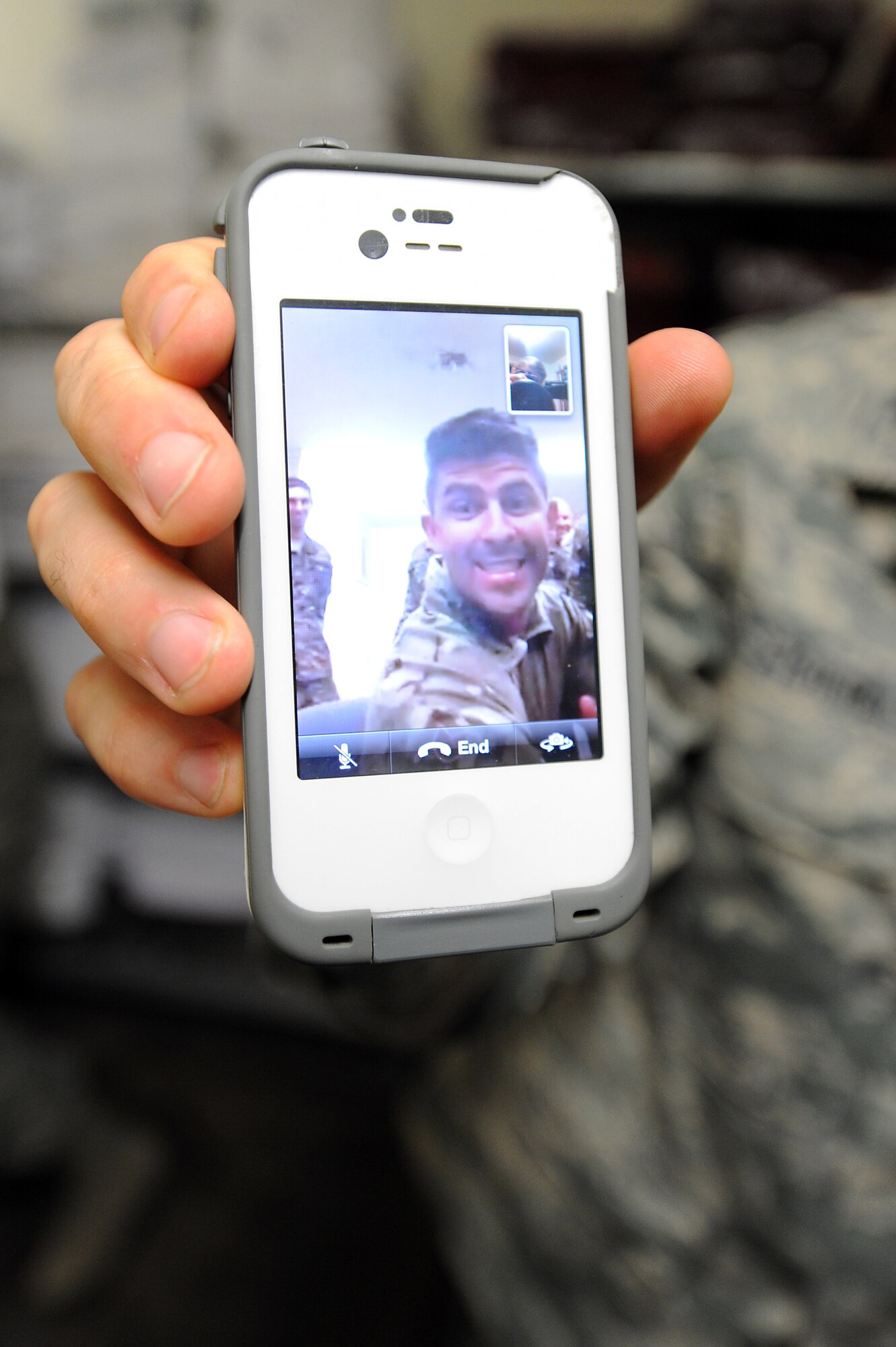 U.S. Air Force Staff Sgt. Brandon Pfannenstiel, 27th Special Operations Civil Engineer Squadron Explosive Ordnance Disposal technician, smiles for the camera during a Facetime Stripes for Exceptional Performers promotion ceremony at Cannon Air Force Base, N.M., Nov. 29, 2012. Because Pfannenstiel was away preparing to deploy, Cannon leadership used alternative methods to award this new Tech. Sgt. his stripes. (U.S. Air Force photo/Senior Airman Jette Carr)