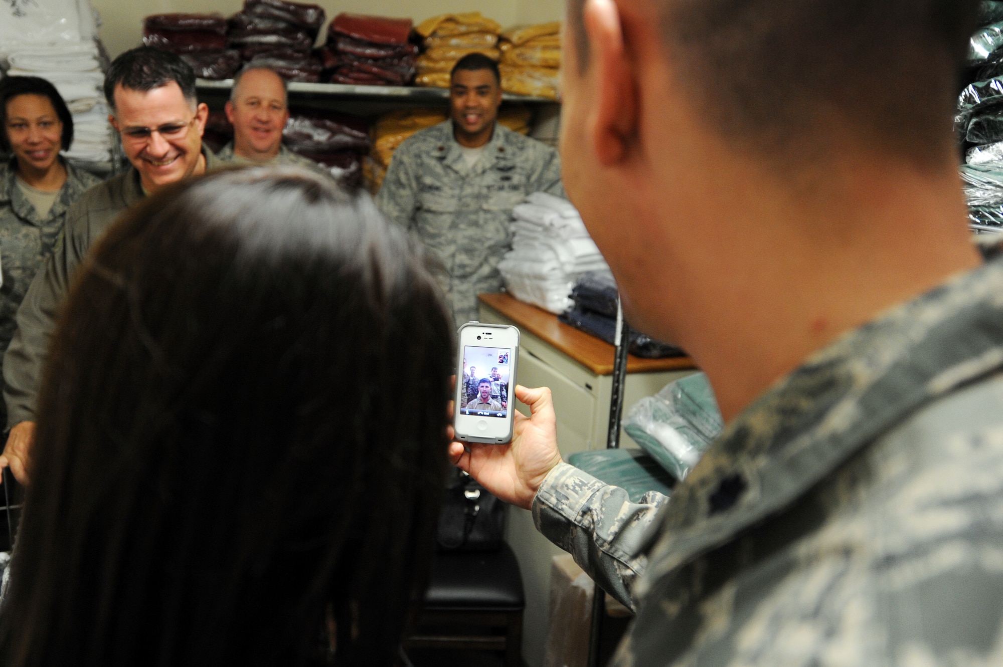 Leadership at Cannon Air Force Base, N.M., Facetime with Staff Sgt. Brandon Pfannenstiel, 27th Special Operations Civil Engineer Squadron Explosive Ordnance Disposal technician, during a surprise Stripes for Exceptional Performers promotion ceremony, Nov. 29, 2012.  Because Pfannenstiel was away preparing to deploy, Cannon leadership used alternative methods to award this new Tech. Sgt. his stripes. (U.S. Air Force photo/Senior Airman Jette Carr)