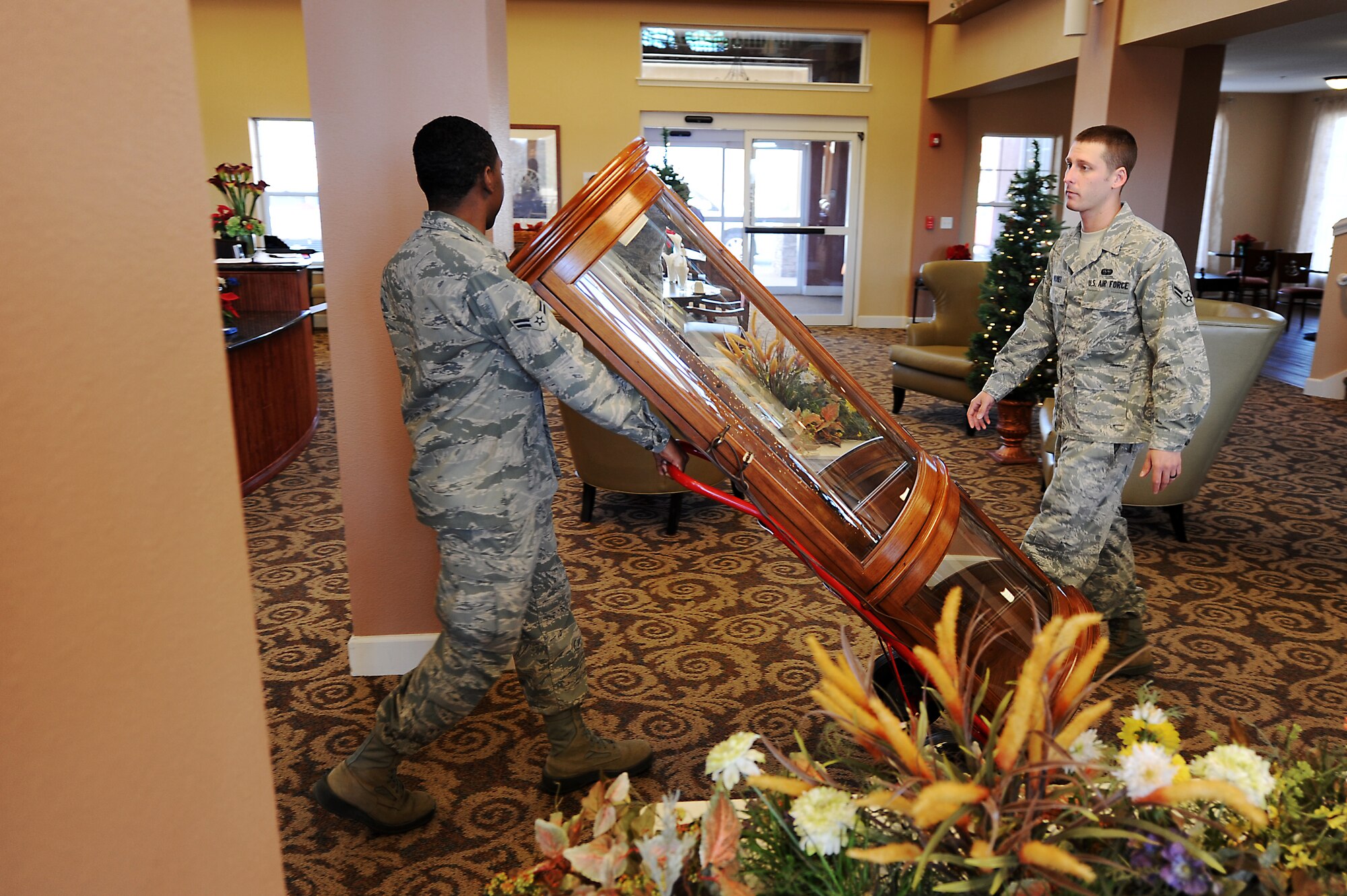 Airmen from Cannon Air Force Base, N.M., move a resident’s belongings to a new room in Wheatfields Senior Living Community in Clovis, N.M., Nov. 29, 2012.  Members of the base offered to lend a helping hand at Wheatfields if ever it was needed. (U.S. Air Force photo/Senior Airman Jette Carr)