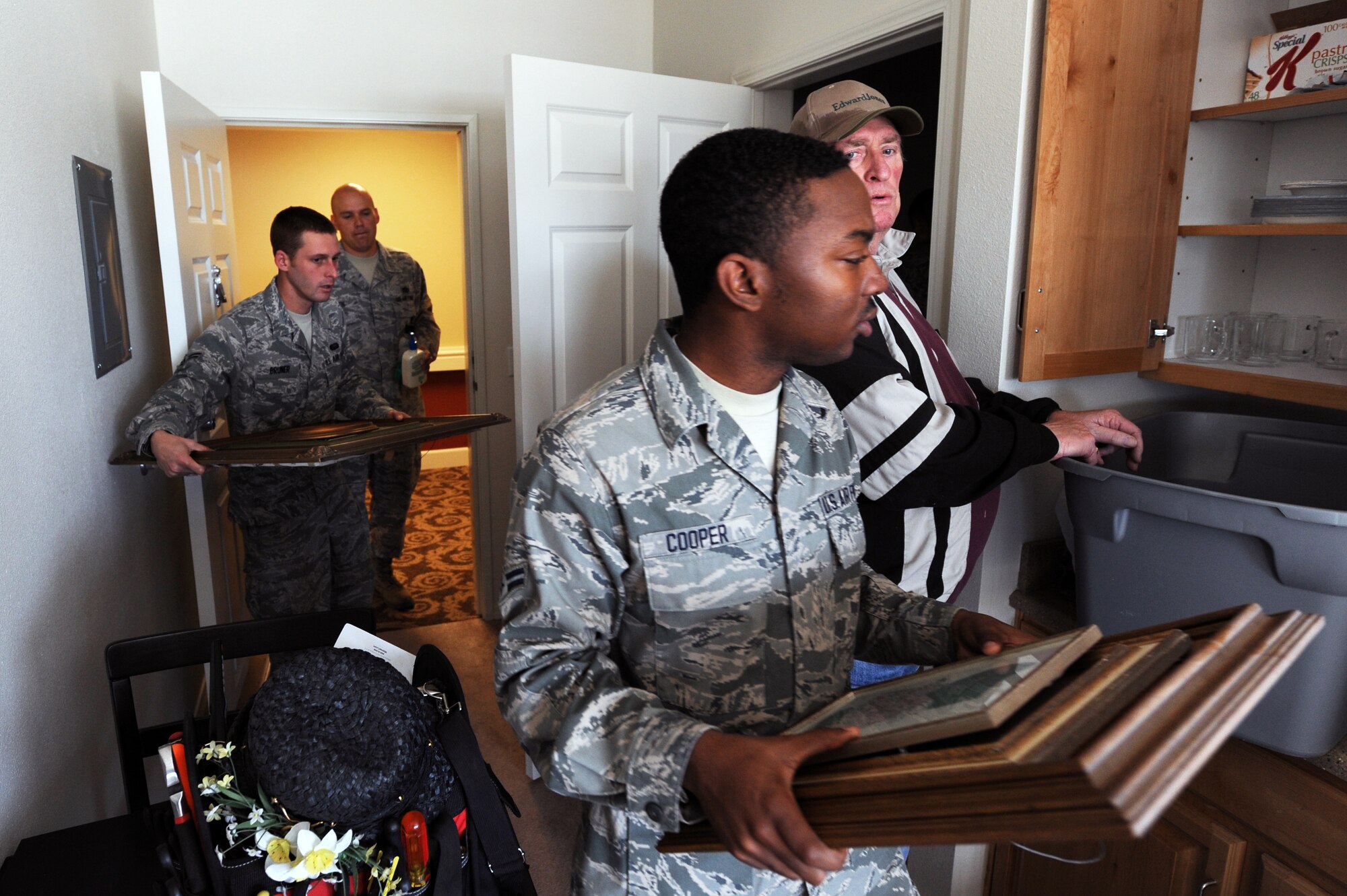 Airmen from Cannon Air Force Base, N.M., move a resident’s belongings to a new room in Wheatfields Senior Living Community in Clovis, N.M., Nov. 29, 2012.  Members of the base offered to lend a helping hand at Wheatfields if ever it was needed. (U.S. Air Force photo/Senior Airman Jette Carr)