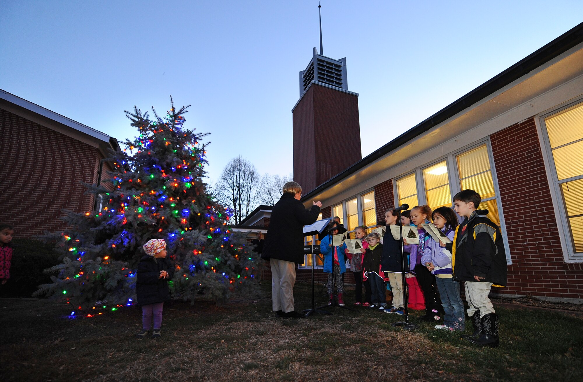 The Strategic Air Command Children’s Church Choir sings Christmas Carols following the annual tree lighting ceremony held at the SAC Chapel on Offutt Air Force Base, Neb., Nov. 29.  The tree lighting and festivities that follow draws hundreds of families each year.  (U.S. Air Force photo by Josh Plueger/Released)