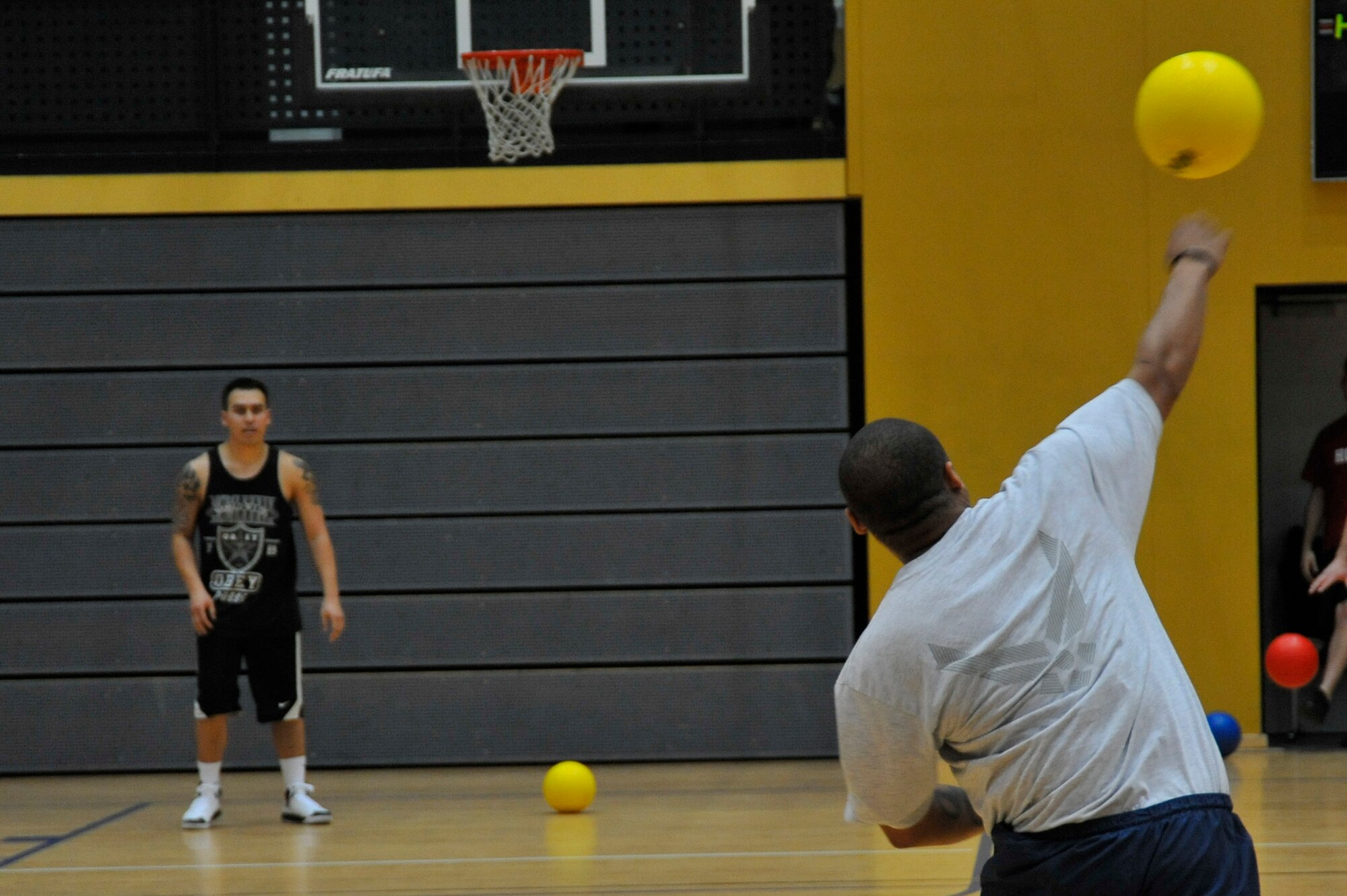 A member of the 569th United States Forces Police Squadron dodgeball team throws the ball at the last member of the 86th Maintenance Squadron team during the championship game of the dodgeball tournament Ramstein Air Base, Germany, Nov. 30, 2012. The 786th Force Support Squadron hosted the tournament in order to foster teamwork and promote morale. (U.S. Air Force photo/Airman 1st Class Trevor Rhynes)