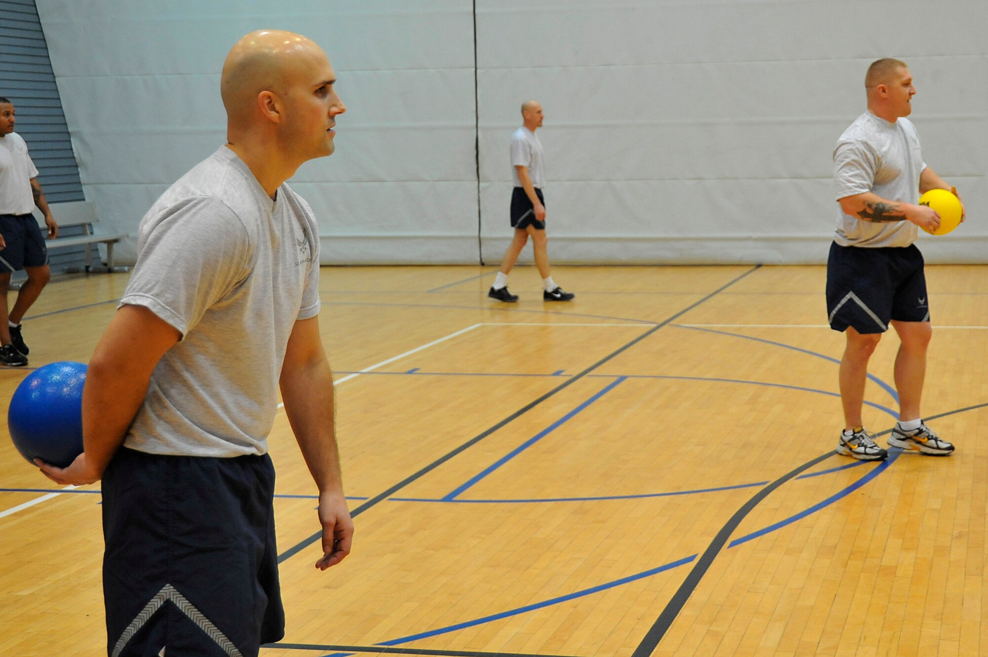 Airmen with the 569th United States Forces Police Squadron wait to make a move during the championship game of the dodgeball tournament, Ramstein Air Base, Germany, Nov. 30, 2012. The 786th Force Support Squadron hosted the tournament in order to foster teamwork and promote morale. (U.S. Air Force photo/Airman 1st Class Trevor Rhynes)