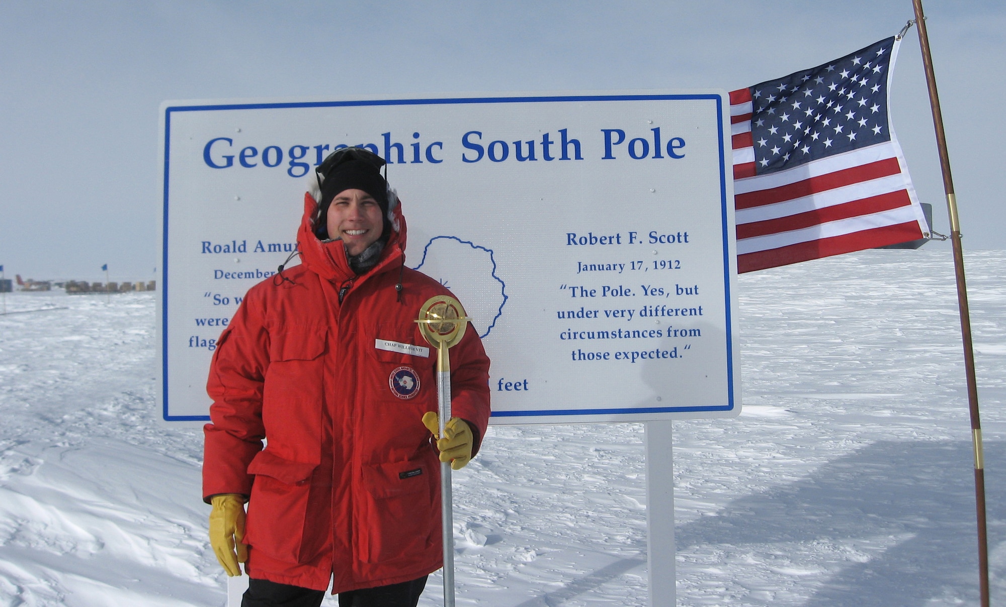 Chaplain (Capt.) William Vit of Sioux City, Iowa, stands at the geographic South Pole. Vit, a priest at the Cathedral of the Epiphany in Sioux City and a member of the Iowa Air National Guard's 185th Air Refueling Wing, is in the Antarctic for a two-month deployment with the National Guard in support of Operation Deep Freeze. U.S. Air Force photo by Staff Sgt. Richard Murphy)
