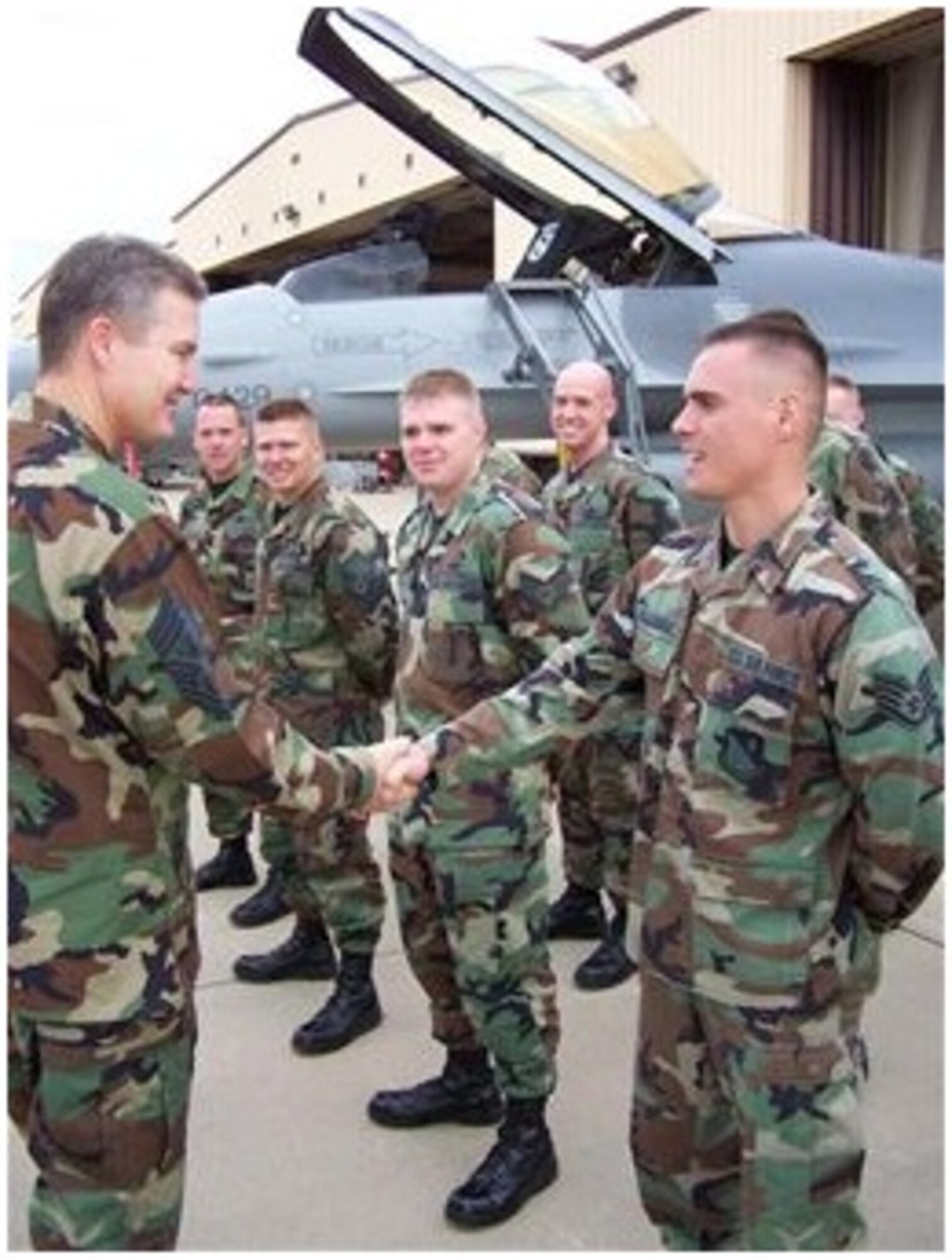 Then-Staff Sgt. Robby Gallegos (right) shakes hands with then-Chief Master Sergeant of the Air Force Gerald Murray during an official visit.  Gallegos completed his CCAF and bachelor’s degrees, and is about to finish his master’s degree while now serving as a Captain in the U.S. Air Force. (Courtesy photo)