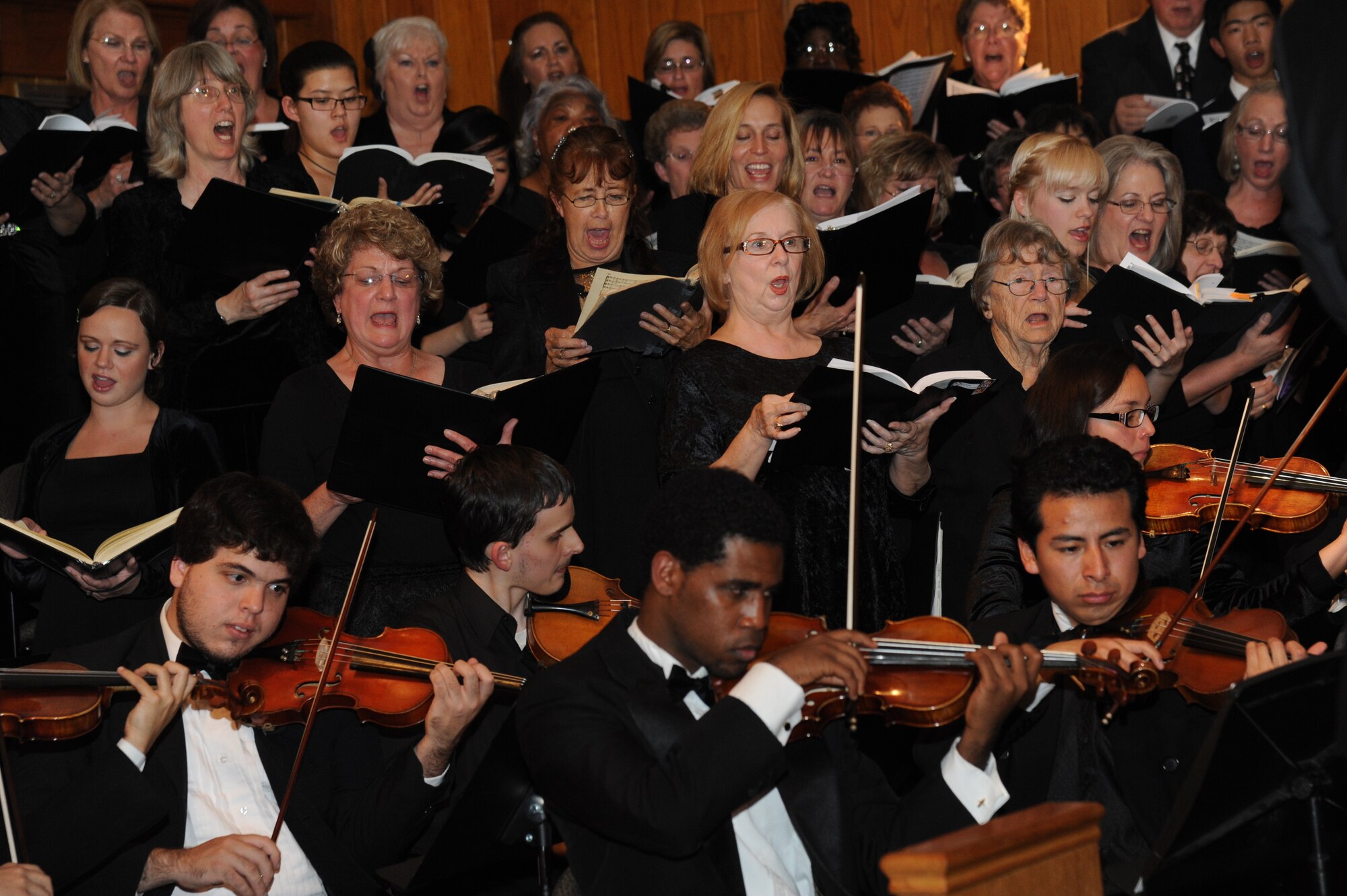 The Gulf Coast Messiah Chorus performs during a 60th Anniversary Celebration Nov. 29, 2012, at the Triangle Chapel, Keesler Air Force Base, Miss., under the direction of conductor Dr. Paul McGahie.  The Choir’s first performance began at Keesler and is now made up by musicians from both the military and civilian communities.  (U.S. Air Force photo by Kemberly Groue)
