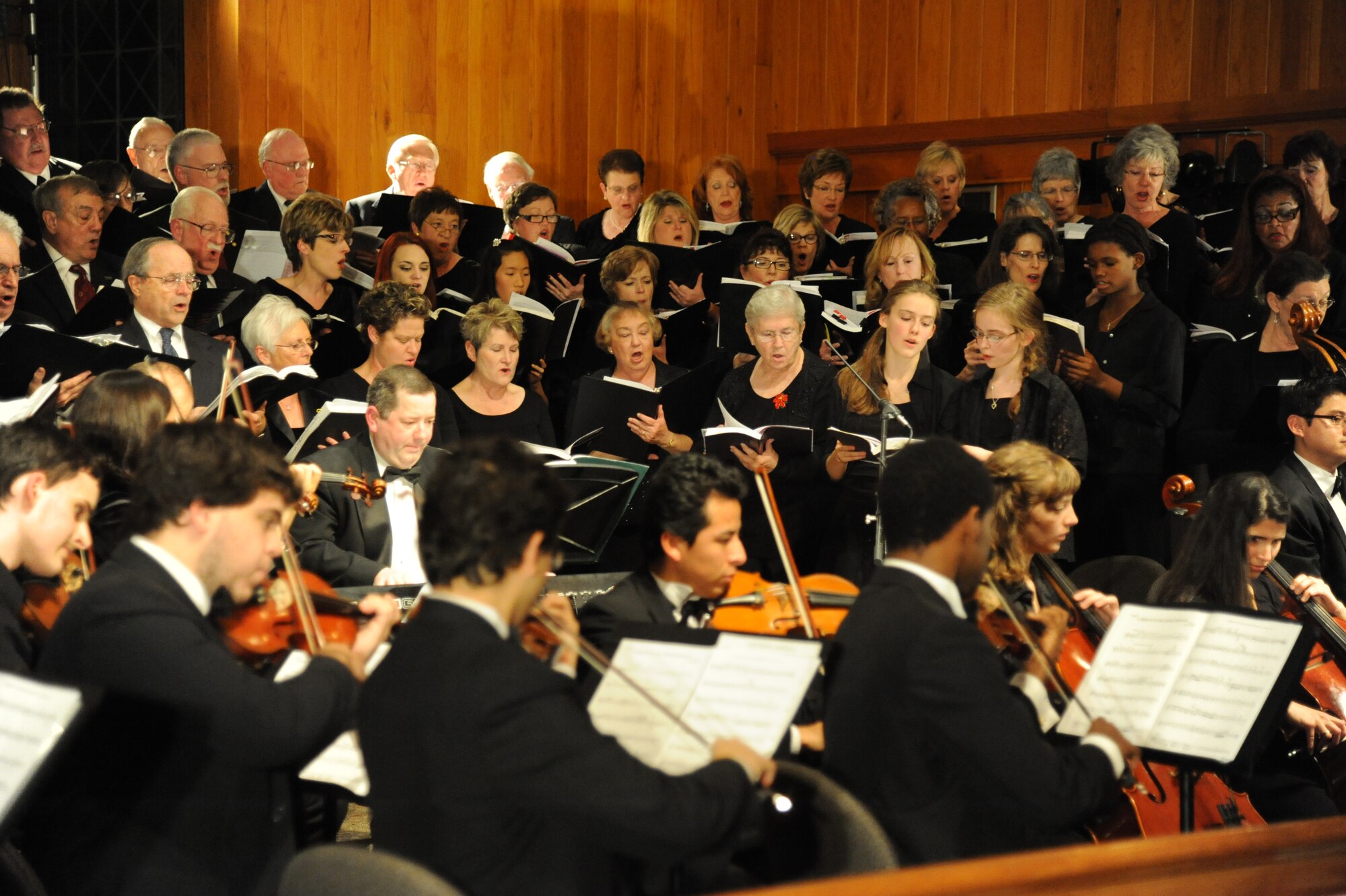 The Gulf Coast Messiah Chorus performs during a 60th Anniversary Celebration Nov. 29, 2012, at the Triangle Chapel, Keesler Air Force Base, Miss., under the direction of conductor Dr. Paul McGahie.  The Choir’s first performance began at Keesler and is now made up by musicians from both the military and civilian communities.  (U.S. Air Force photo by Kemberly Groue)