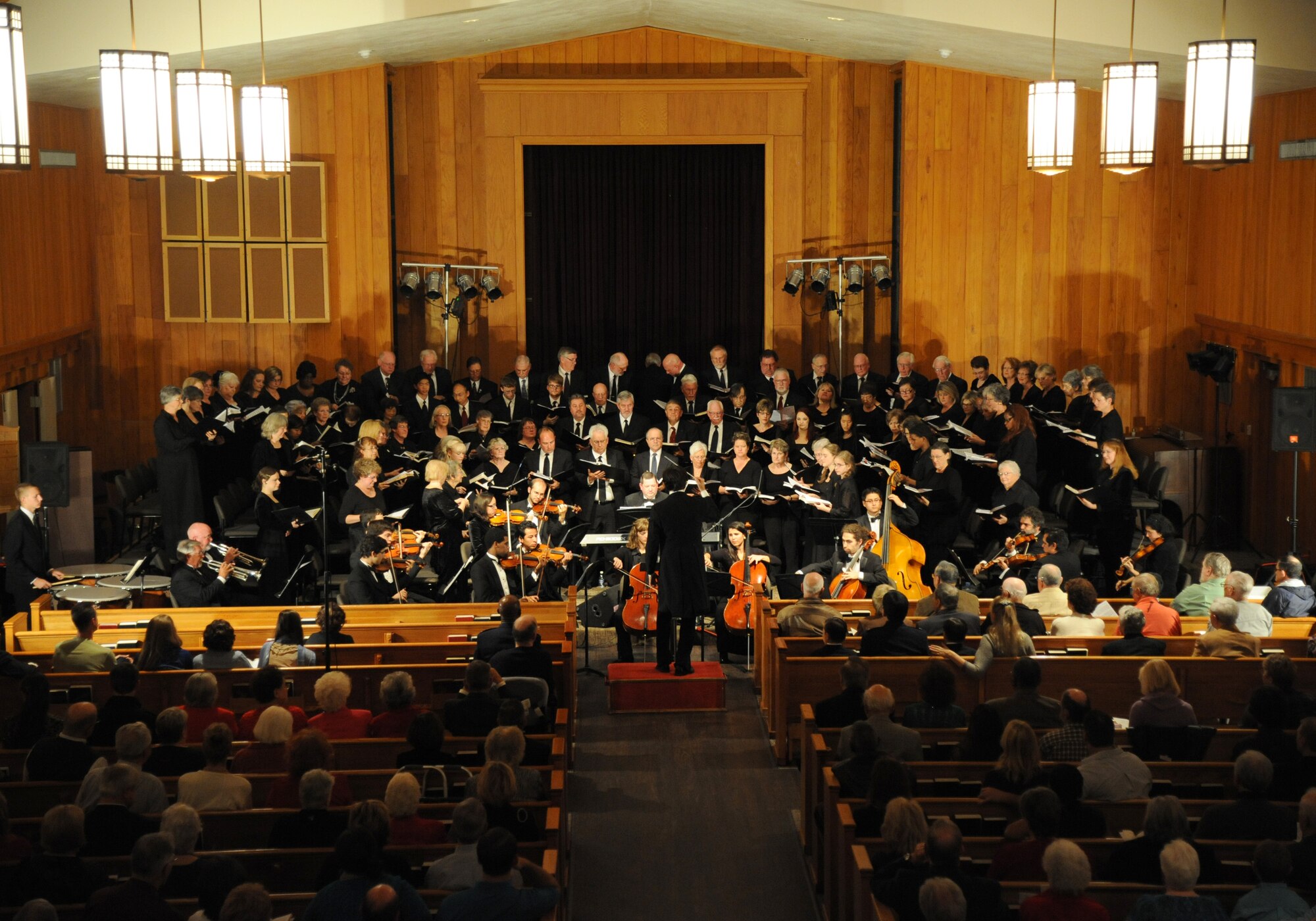 The Gulf Coast Messiah Chorus performs during a 60th Anniversary Celebration Nov. 29, 2012, at the Triangle Chapel, Keesler Air Force Base, Miss., under the direction of conductor Dr. Paul McGahie.  The Choir’s first performance began at Keesler and is now made up by musicians from both the military and civilian communities.  (U.S. Air Force photo by Kemberly Groue)