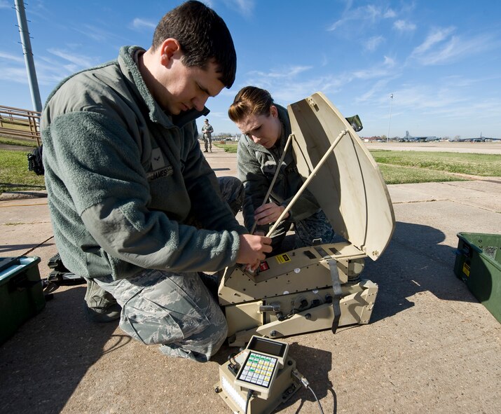Airman 1st Class Stephen James, 2nd Bomb Wing Command Post, and Tech. Sgt. Amber Perry, 307 BW Command Post, assemble a Single Channel Anti-jam Man Portable during a Nuclear Surety Staff Assistance Visit on Barksdale Air Force Base, La., Nov. 29. The SCAMP is a satellite communication device used by ground troops for secure strategic communications. (U.S. Air Force photo/Staff Sgt. Chad Warren)
