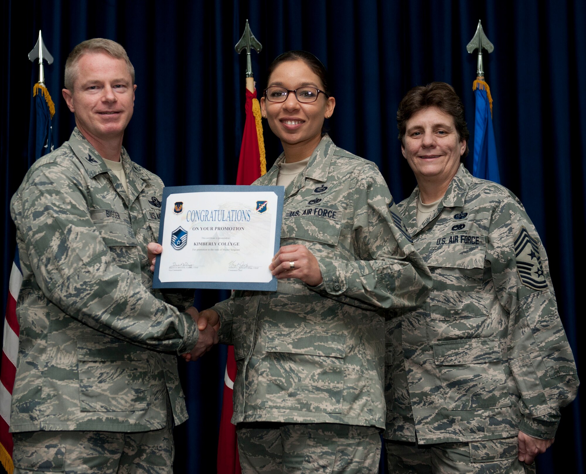 Kimberly Collyge, 39th Air Base Wing, is promoted to the rank of master sergeant Nov. 30, 2012, at the club complex ballroom at Incirlik Air Base, Turkey. (U.S. Air Force photo by Senior Airman Clayton Lenhardt/Released)