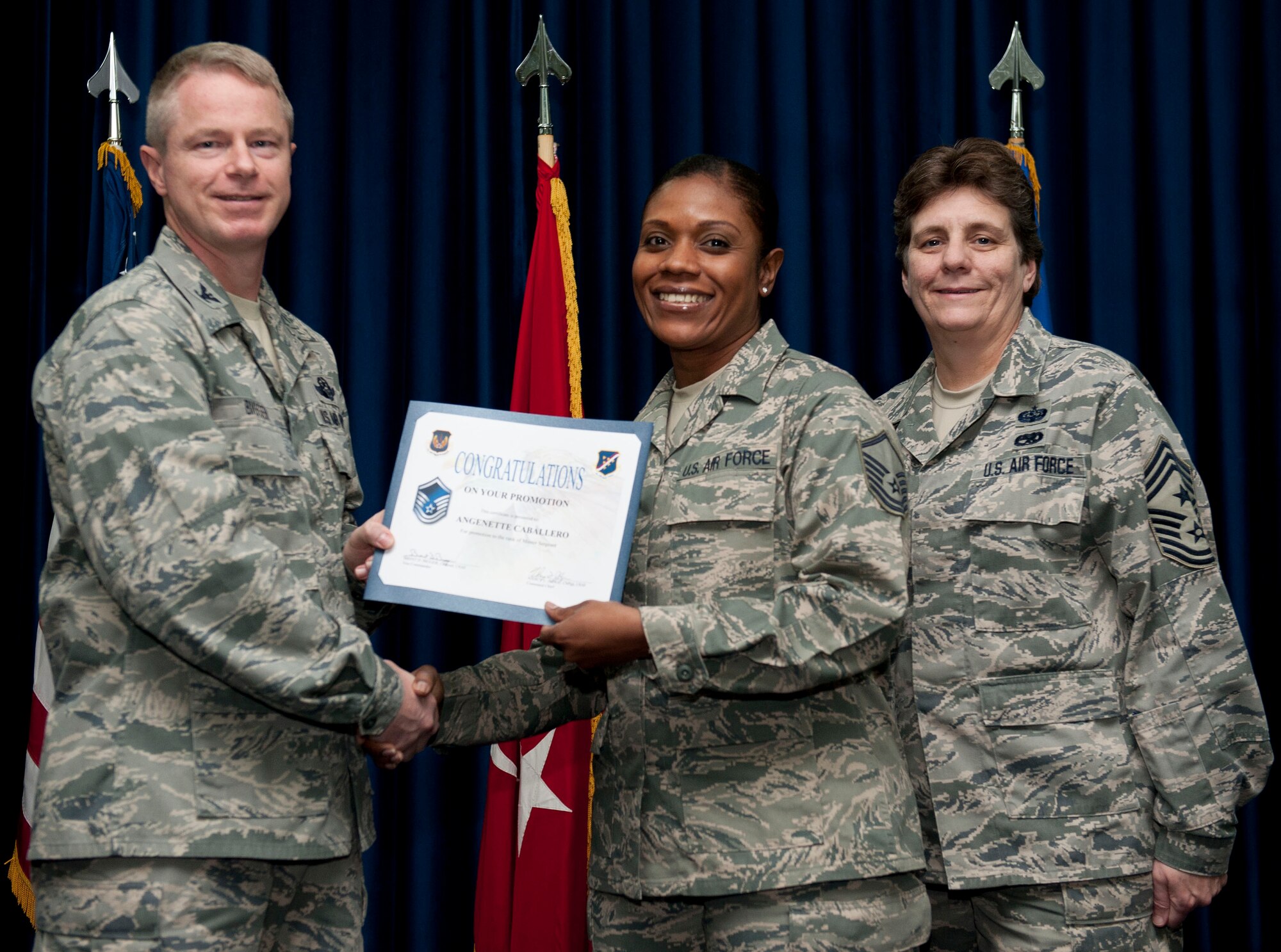 Angenette Caballero, 728th Air Mobility Squaddron, is promoted to the rank of master sergeant Nov. 30, 2012, at the club complex ballroom at Incirlik Air Base, Turkey. (U.S. Air Force photo by Senior Airman Clayton Lenhardt/Released)