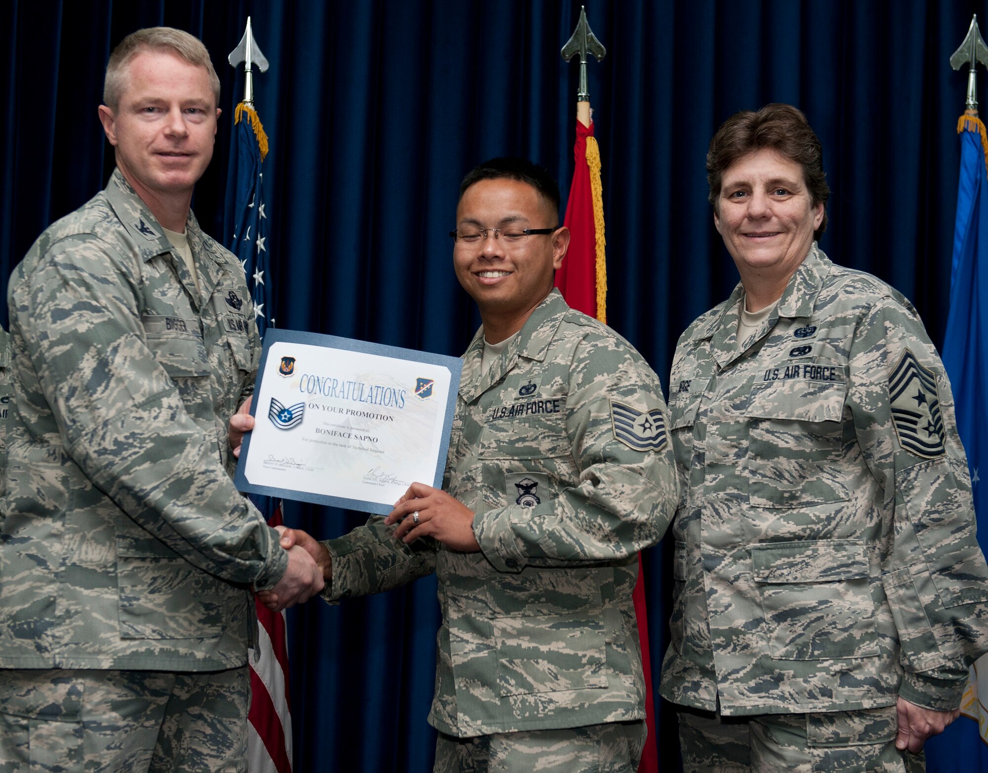 Boniface Sapno, 39th Security Forces Squadron, is promoted to the rank of technical sergeant Nov. 30, 2012, at the club complex ballroom at Incirlik Air Base, Turkey. (U.S. Air Force photo by Senior Airman Clayton Lenhardt/Released)