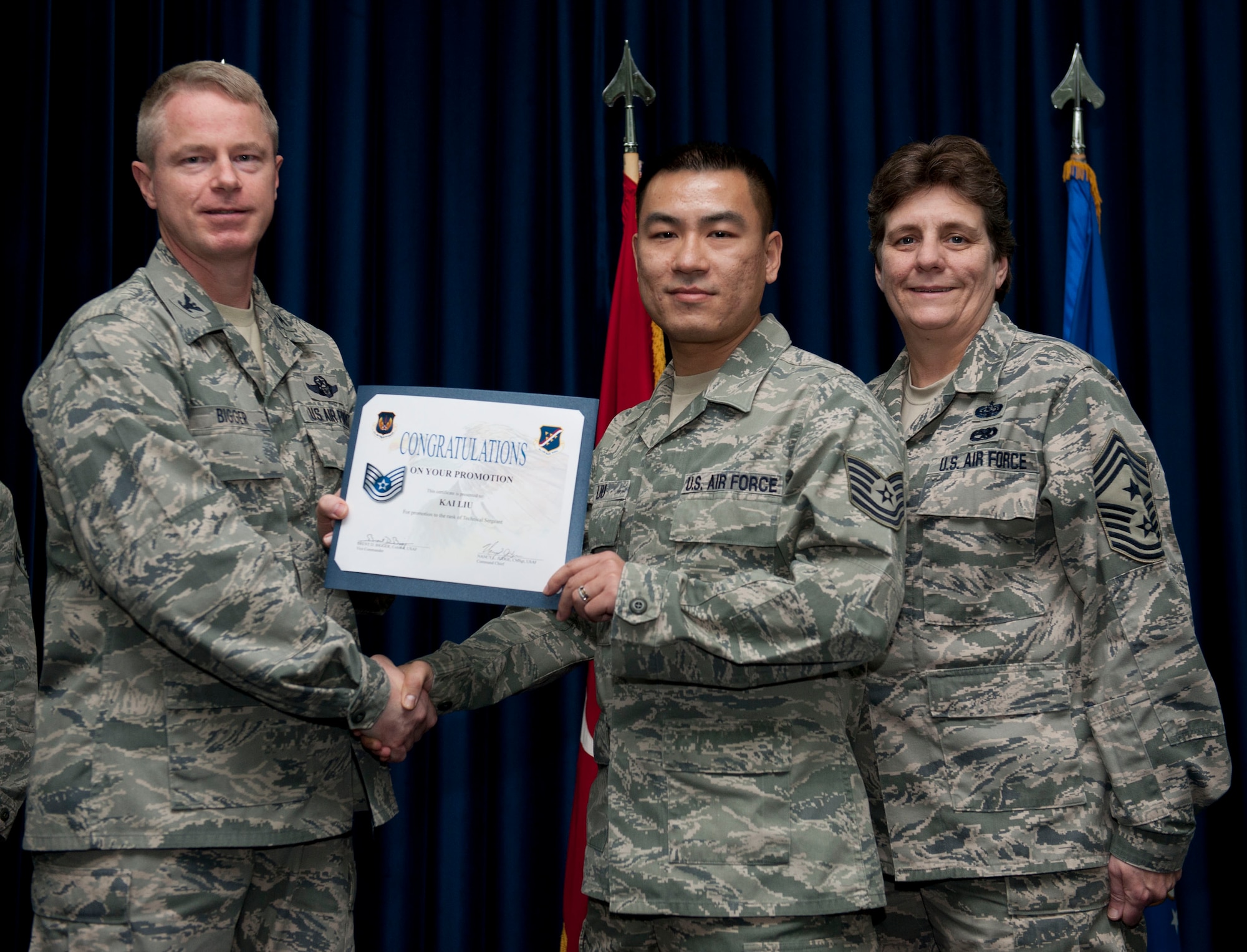Kai Liu, 39th Communications Squadron is promoted to the rank of technical sergeant Nov. 30, 2012, at the club complex ballroom at Incirlik Air Base, Turkey. (U.S. Air Force photo by Senior Airman Clayton Lenhardt/Released)