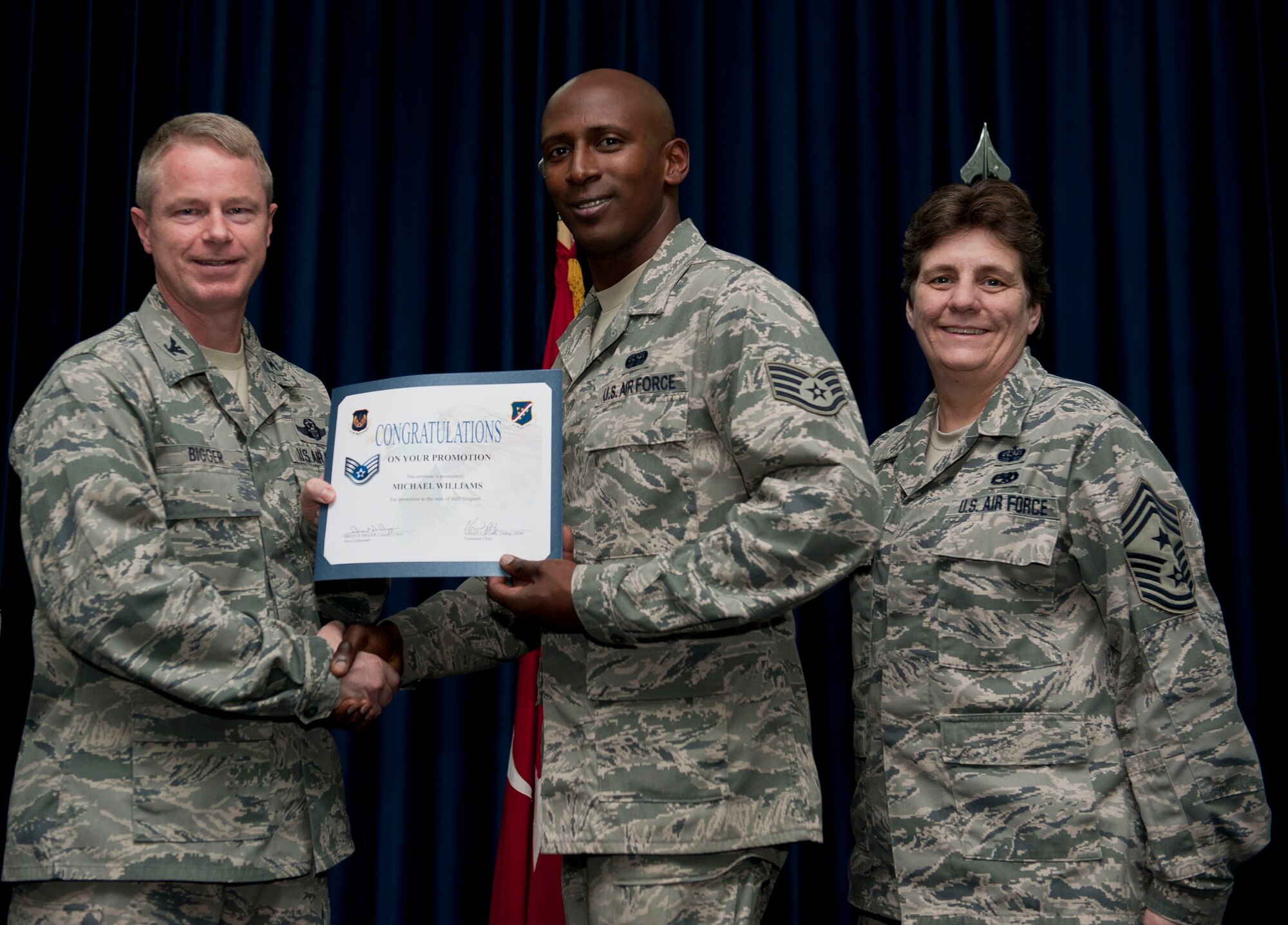 Michael Williams, 39th Communications Squadron, is promoted to the rank of staff sergeant Nov. 30, 2012, at the club complex ballroom at Incirlik Air Base, Turkey. (U.S. Air Force photo by Senior Airman Clayton Lenhardt/Released)