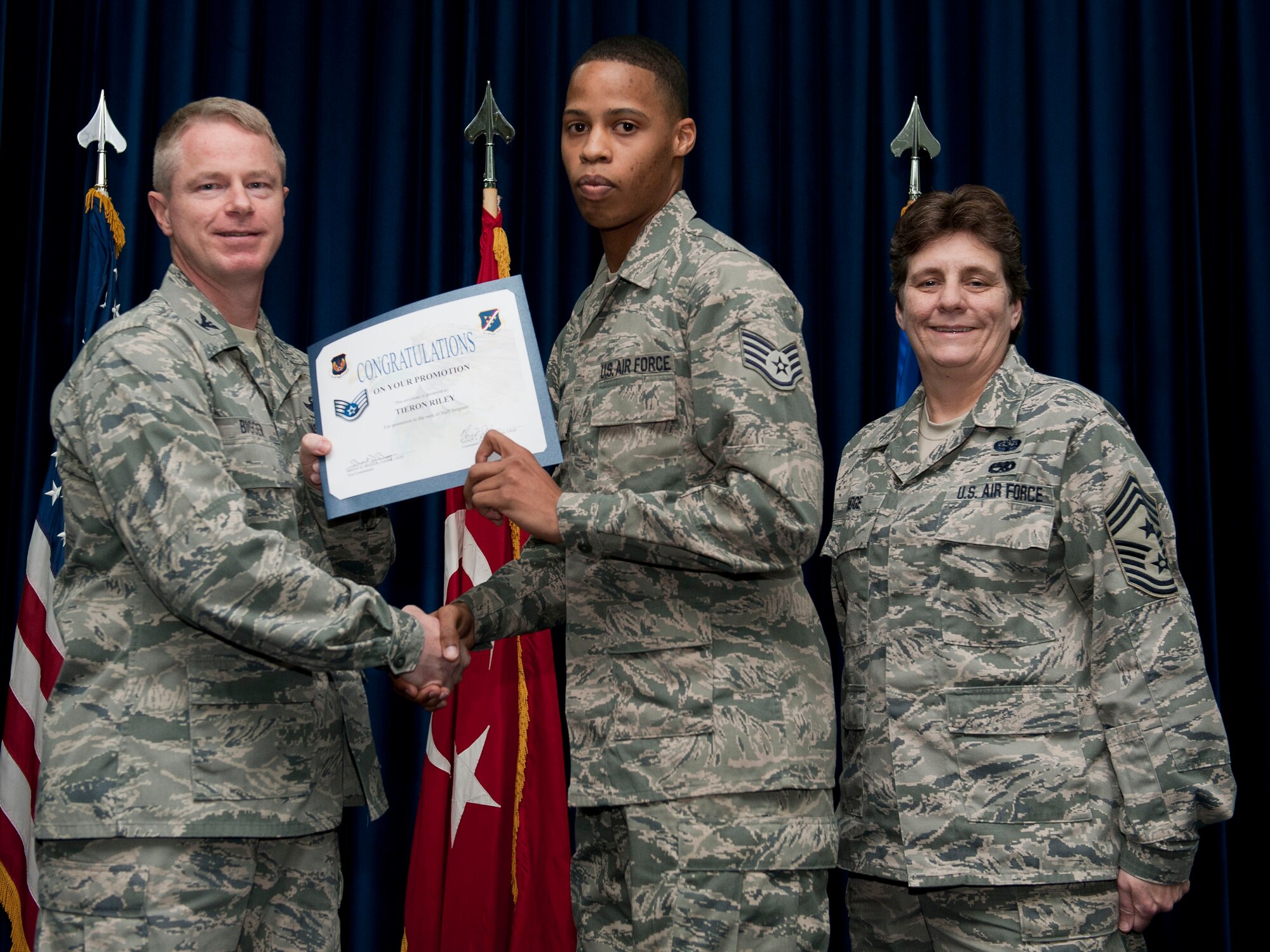 Tieron Riley, 39th Maintenance Squadron, is promoted to the rank of staff sergeant Nov. 30, 2012, at the club complex ballroom at Incirlik Air Base, Turkey. (U.S. Air Force photo by Senior Airman Clayton Lenhardt/Released)