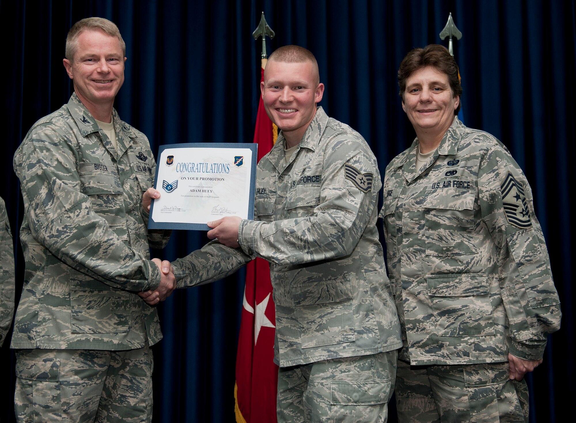 Adam Huey, 39th Medical Support Squadron, is promoted to the rank of staff sergeant Nov. 30, 2012, at the club complex ballroom at Incirlik Air Base, Turkey. (U.S. Air Force photo by Senior Airman Clayton Lenhardt/Released)