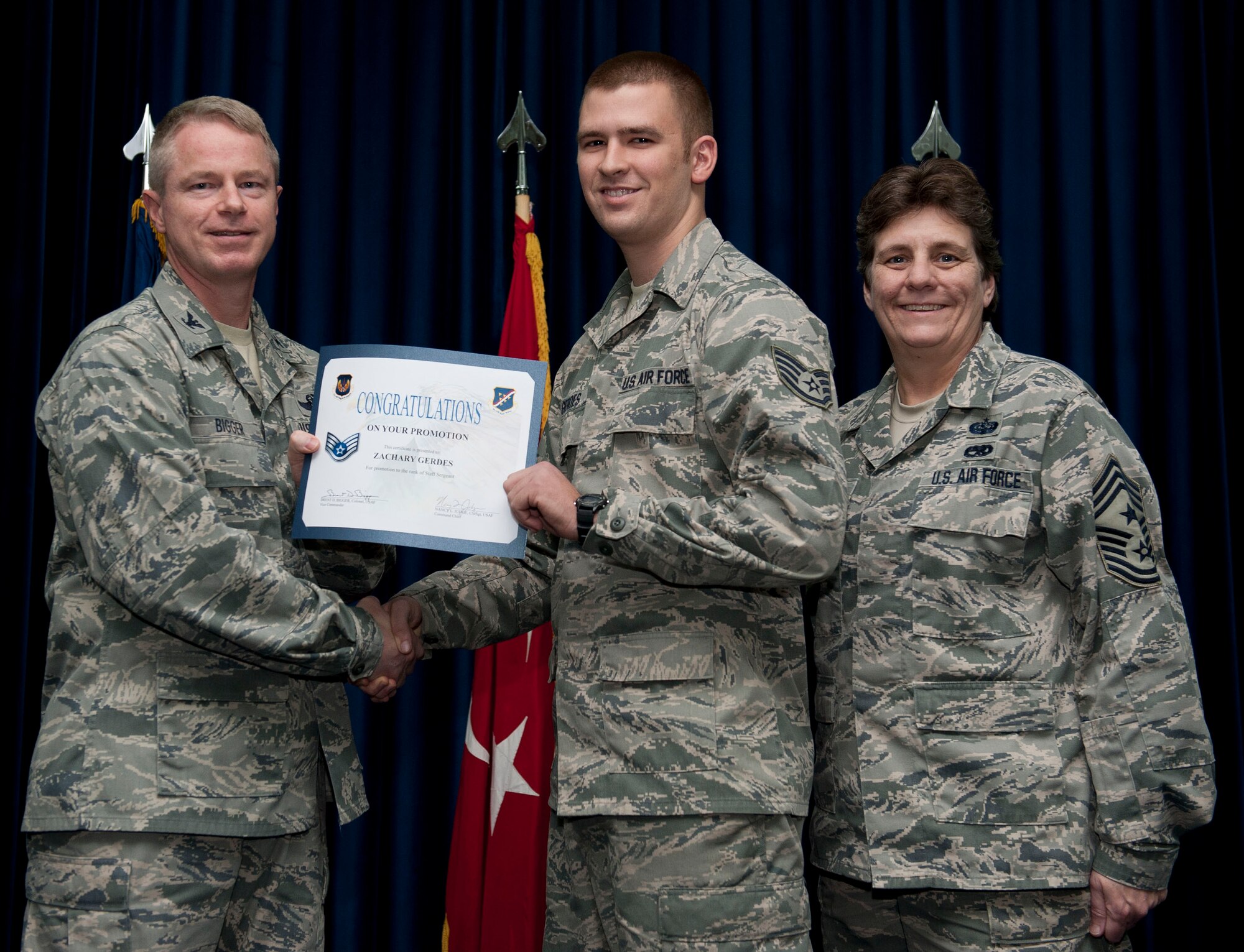 Zachary Gerdes, 728th Air Mobility Squadron, is promoted to the rank of staff sergeant Nov. 30, 2012, at the club complex ballroom at Incirlik Air Base, Turkey. (U.S. Air Force photo by Senior Airman Clayton Lenhardt/Released)
