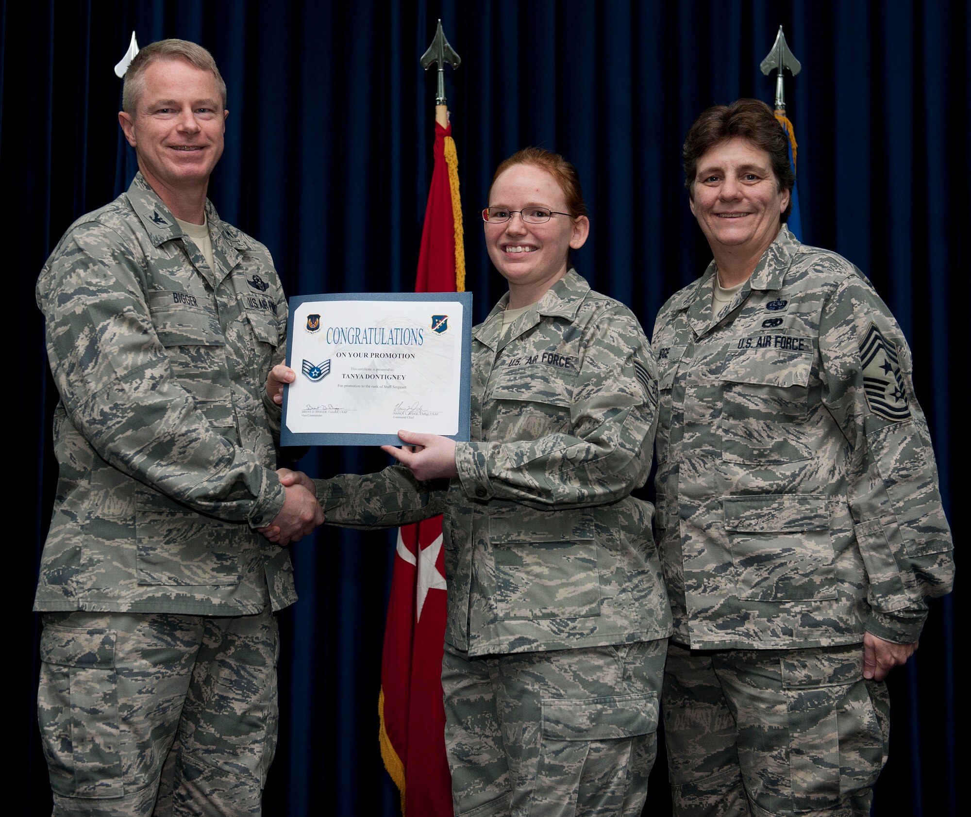 Tanya Dontigney, 39th Communications Squadron, is promoted to the rank of staff sergeant Nov. 30, 2012, at the club complex ballroom at Incirlik Air Base, Turkey. (U.S. Air Force photo by Senior Airman Clayton Lenhardt/Released)
