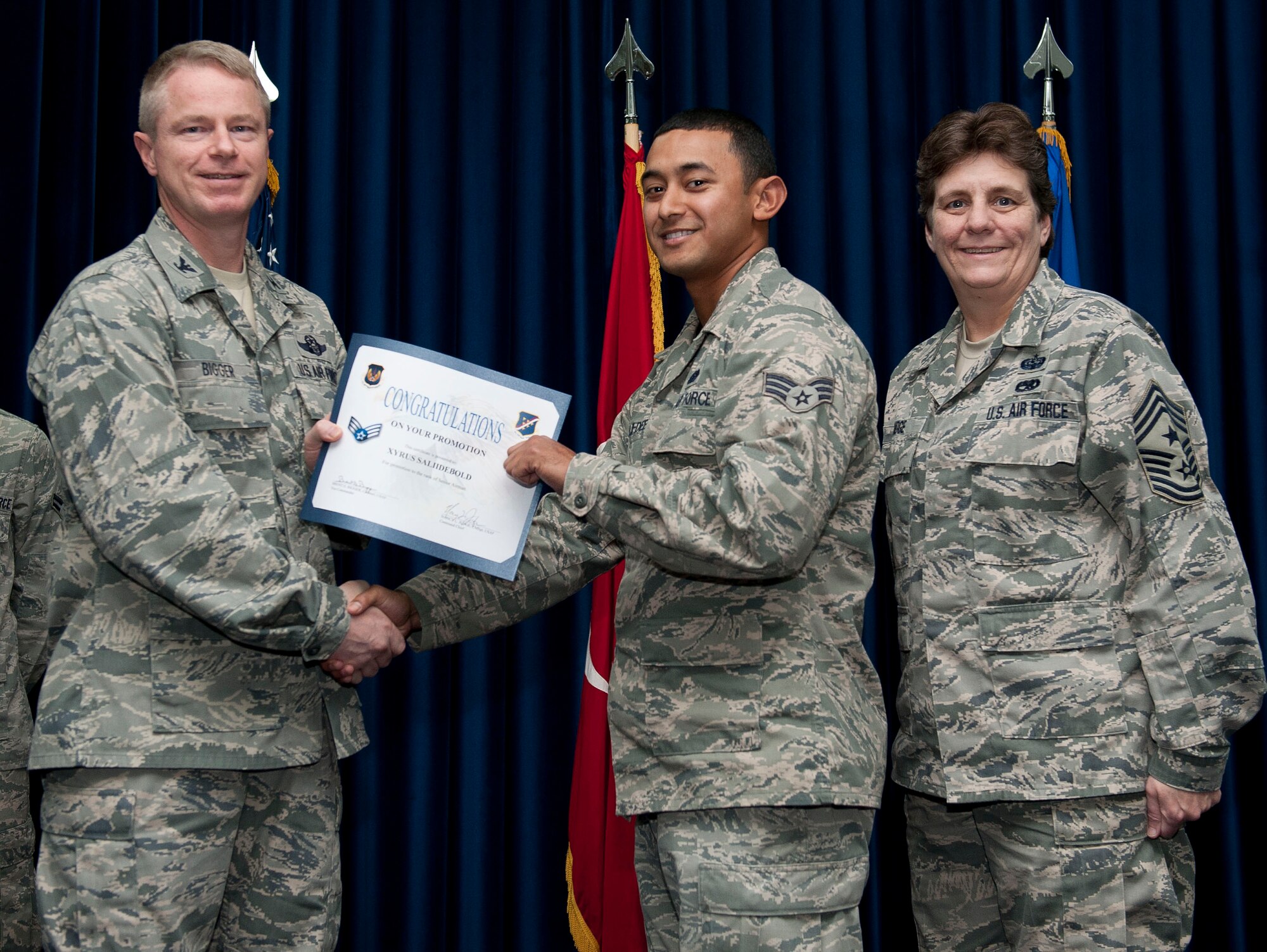 Xyrus Salii-Debold, 39th Communications Squadron, is promoted to the rank of senior airman Nov. 30, 2012, at the club complex ballroom at Incirlik Air Base, Turkey. (U.S. Air Force photo by Senior Airman Clayton Lenhardt/Released)